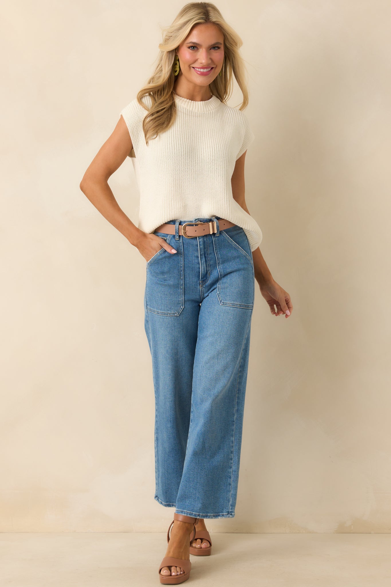 Full length view of the jeans styled to emphasize the functional belt loops and clean wide leg shape.