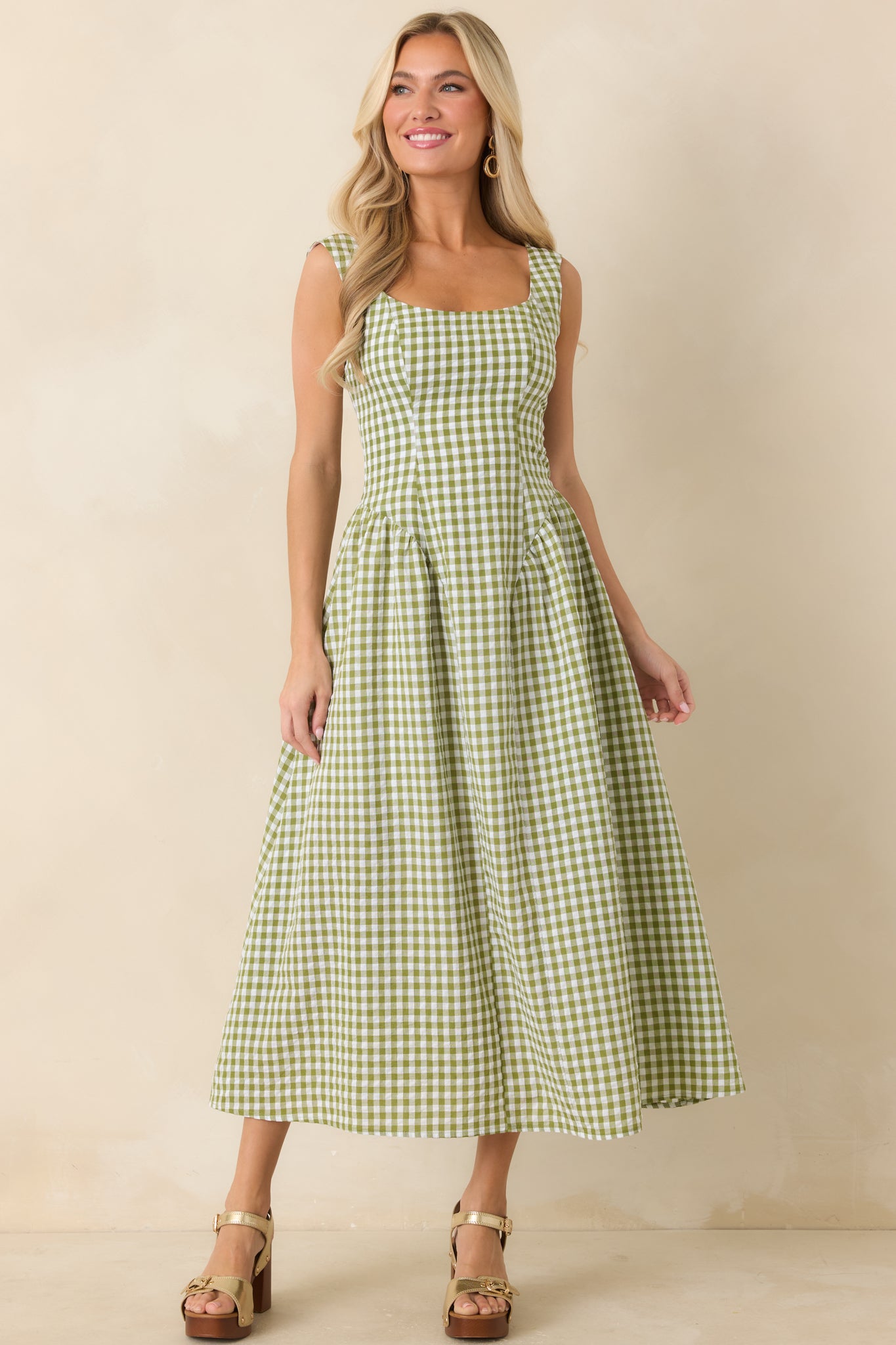 Classic gingham midi dress with a tailored bodice, wide shoulder straps, and a clean, voluminous skirt.