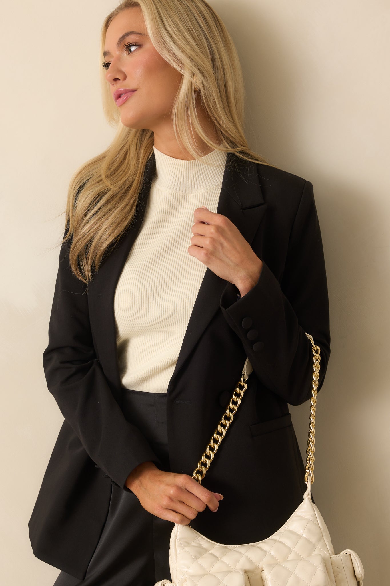 Cropped front shot emphasizing the lightweight shoulder pads and overall fit of the blazer.