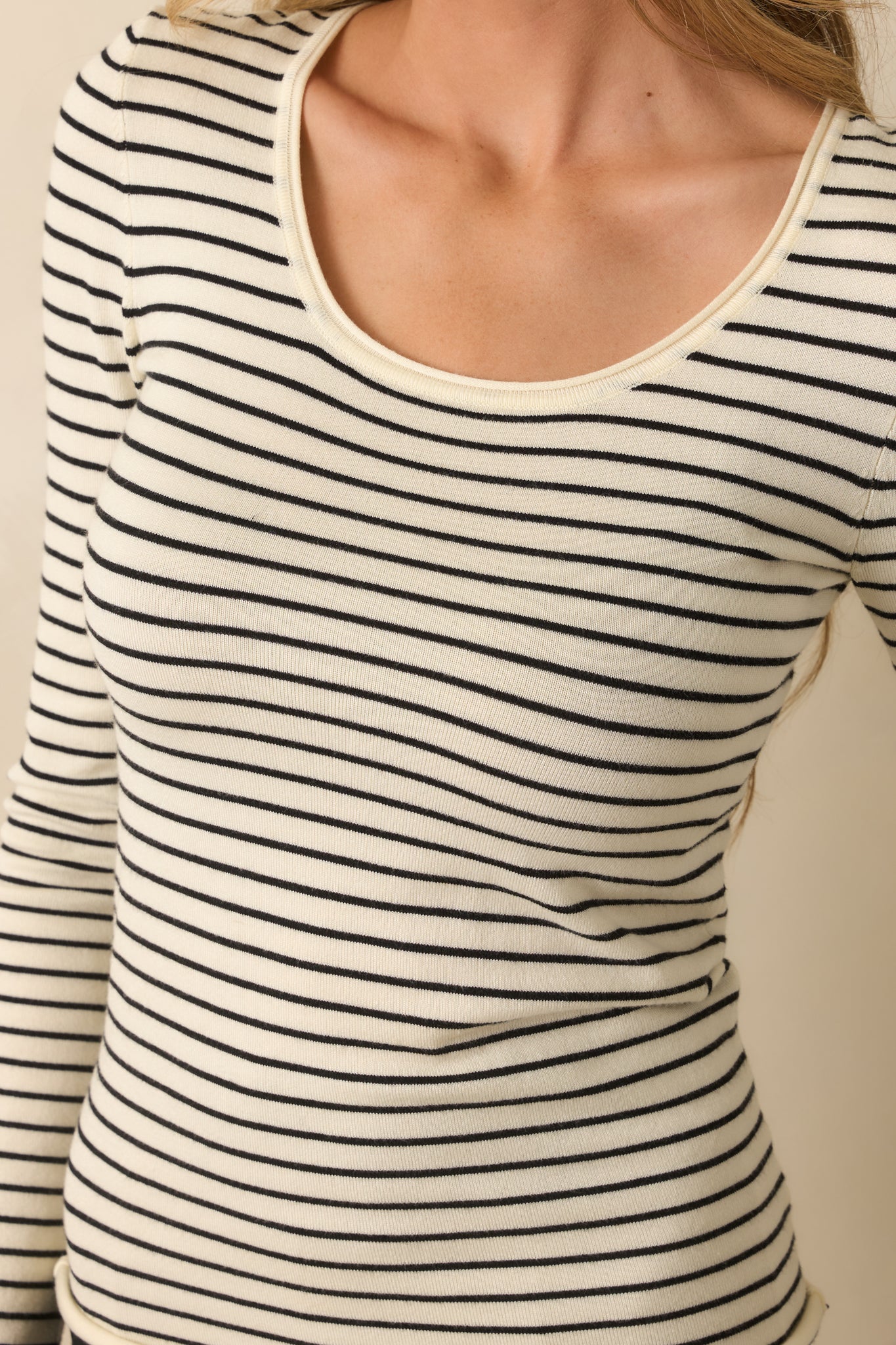 Close-up showing the ivory and black stripe pattern and texture of the cozy lightweight fabric.