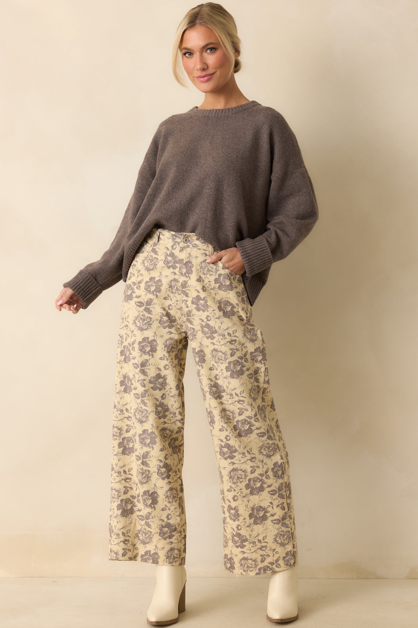 Soft ash grey sweater displayed fully front-facing, emphasizing its plush texture and classic crew neck.