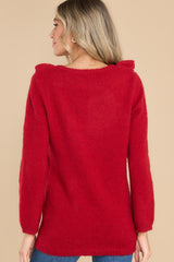 Back view of this sweater that features a scoop neckline.