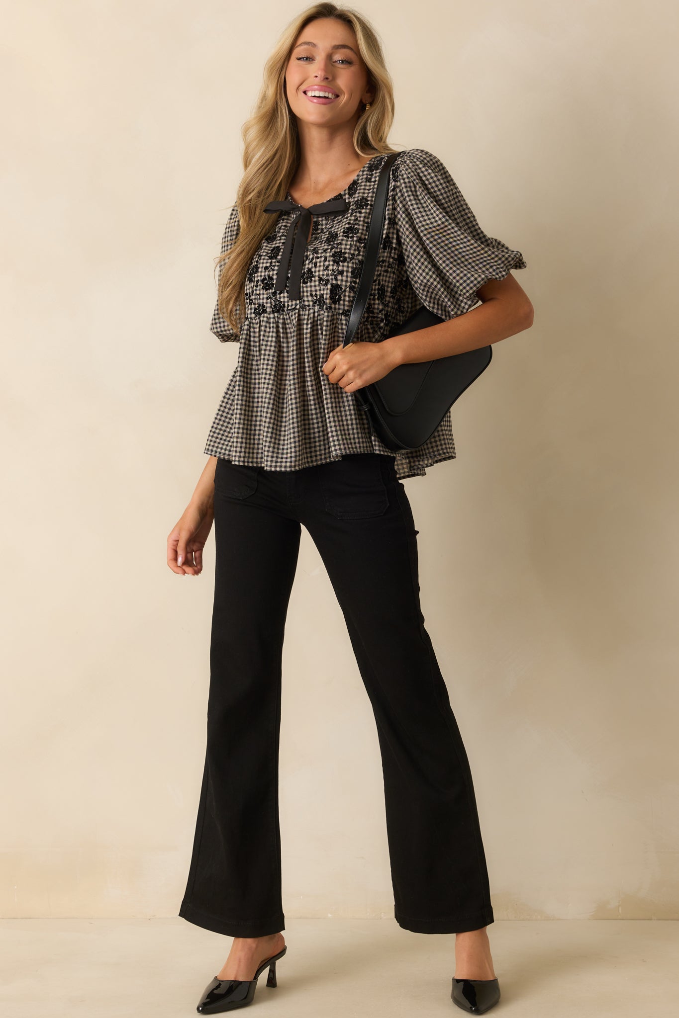 Top with optional self-tie front detail and relaxed fit over the peplum hem.
