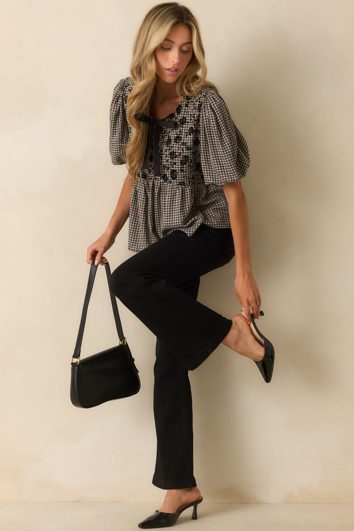 Black and ivory gingham top with black velvet floral pattern on the bodice and split v-neckline.
