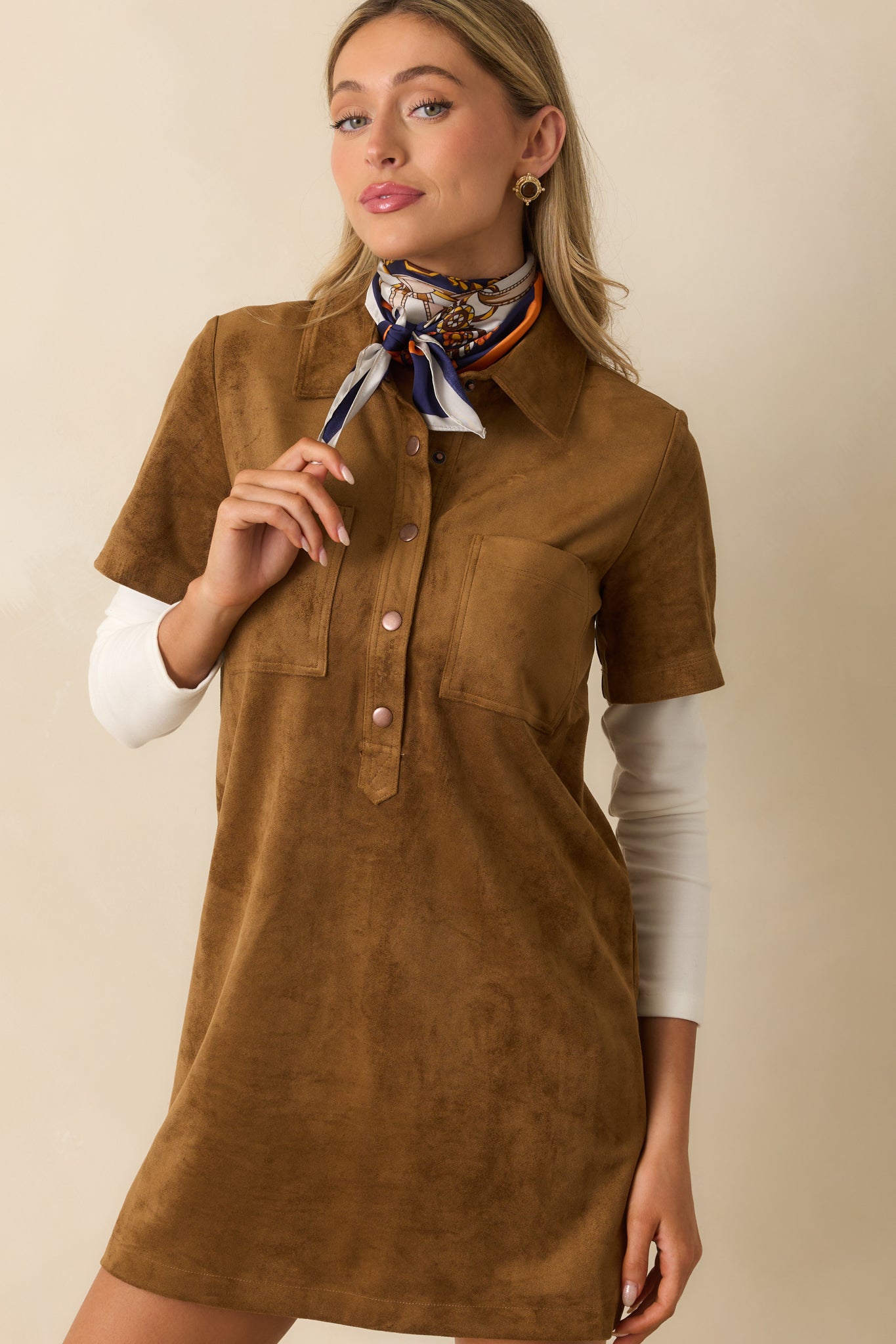Front crop emphasizing the button closure and structured collar.