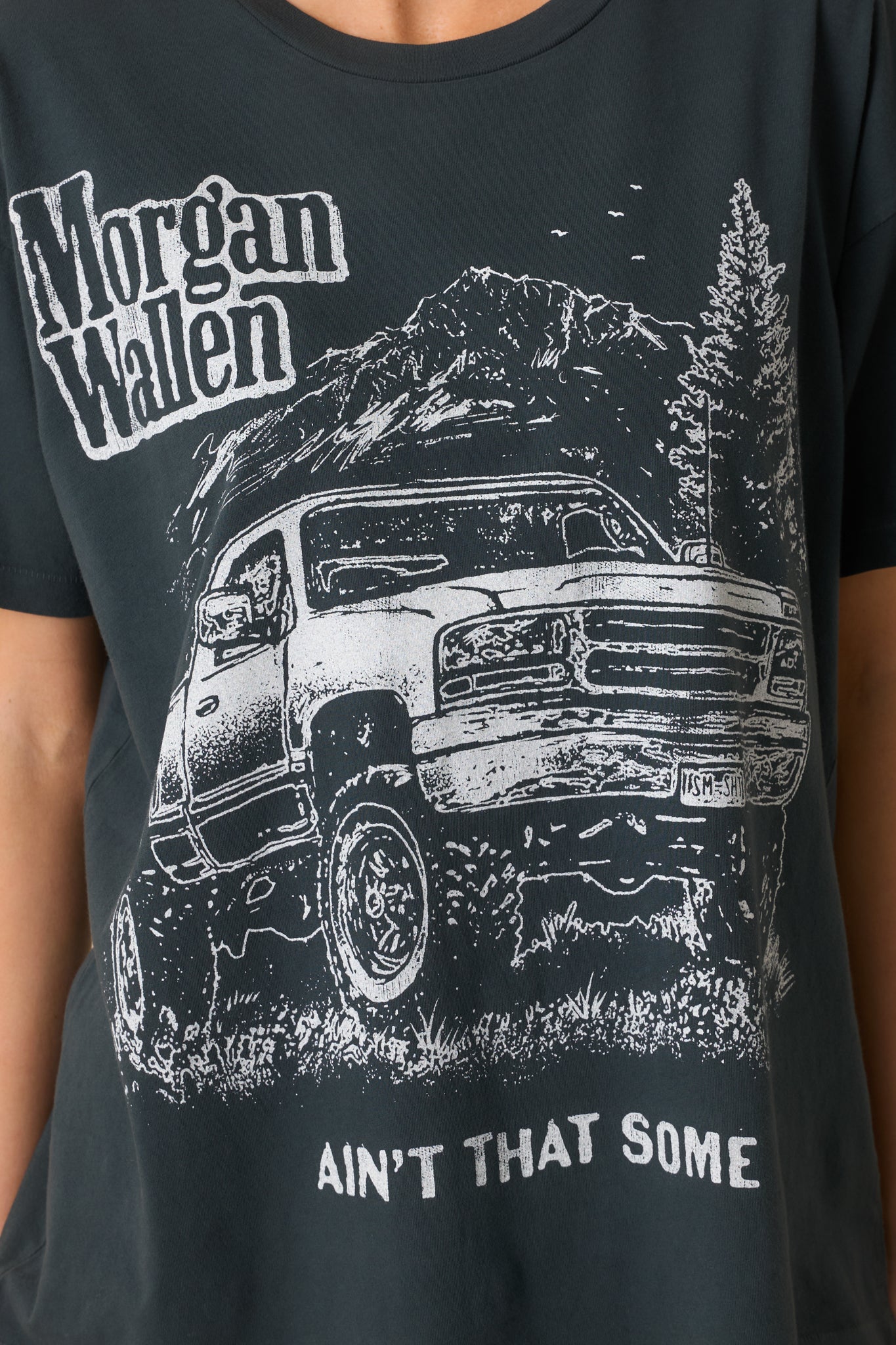 Ultra-close look at black cotton fabric and printed graphic design.