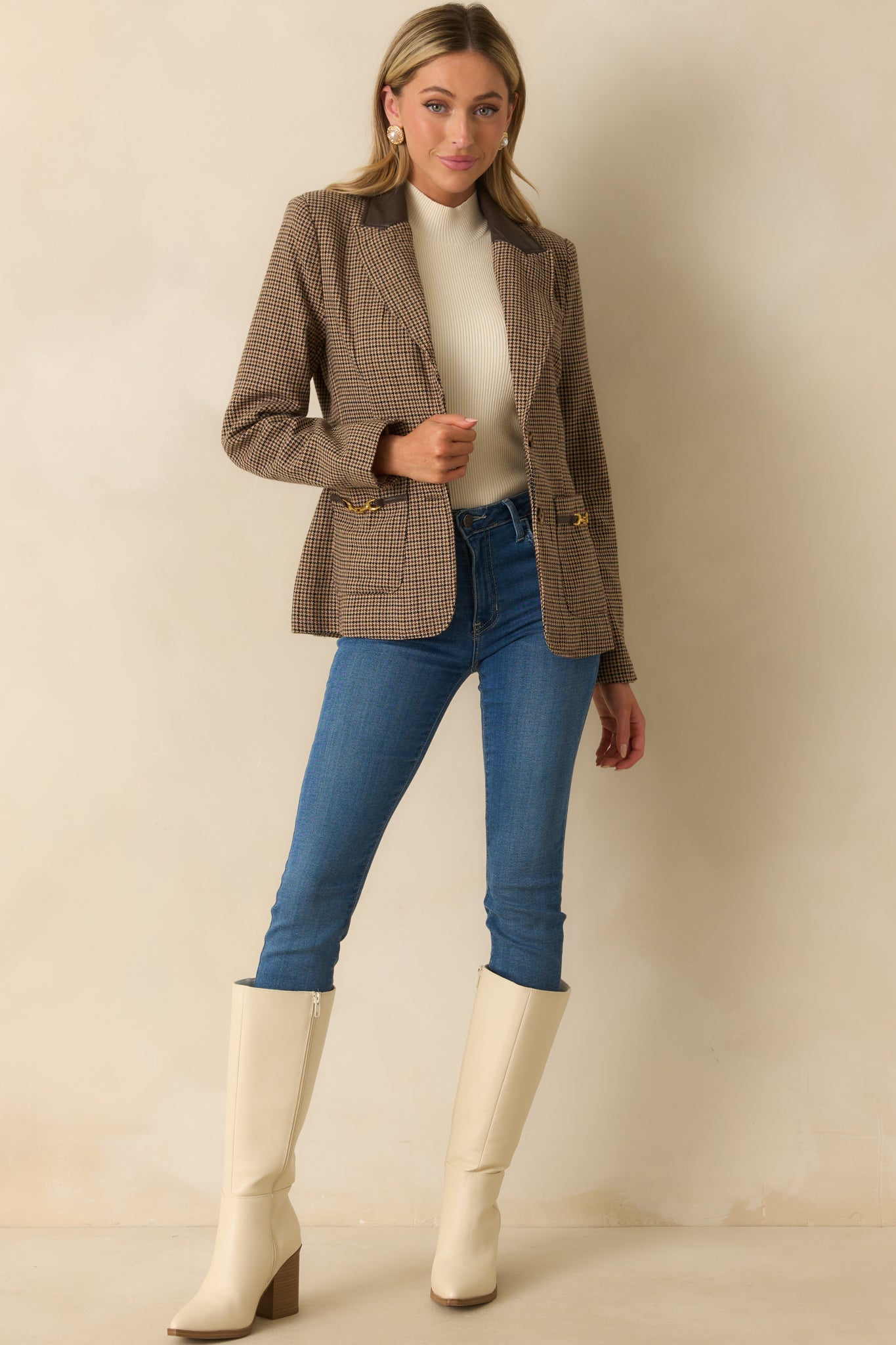 Tailored brown blazer with houndstooth pattern, structured shoulders, and sleek straight-cut silhouette.