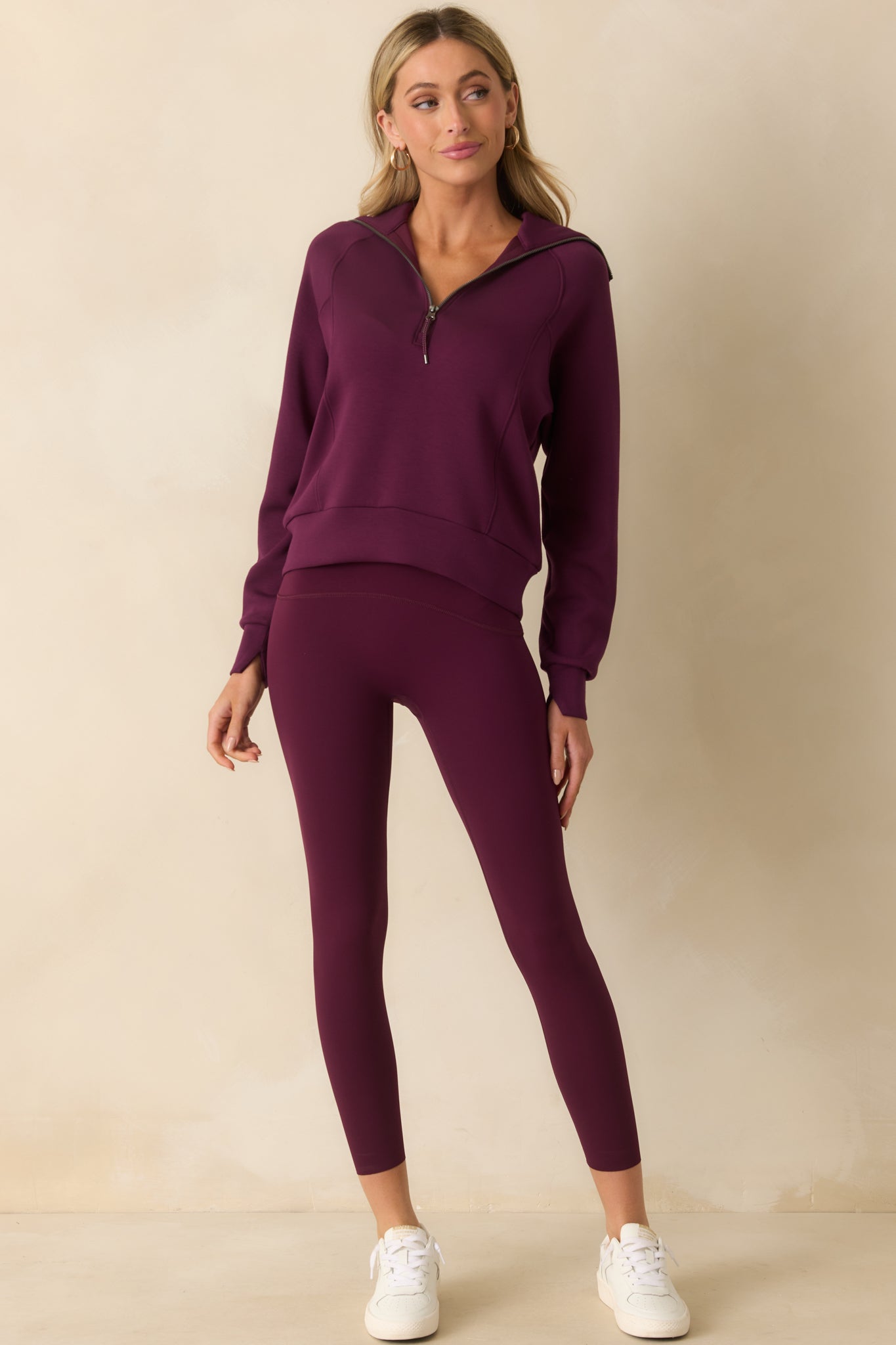 Full body shot showing the lightweight spacer fabric and relaxed silhouette of the plum berry pullover.
