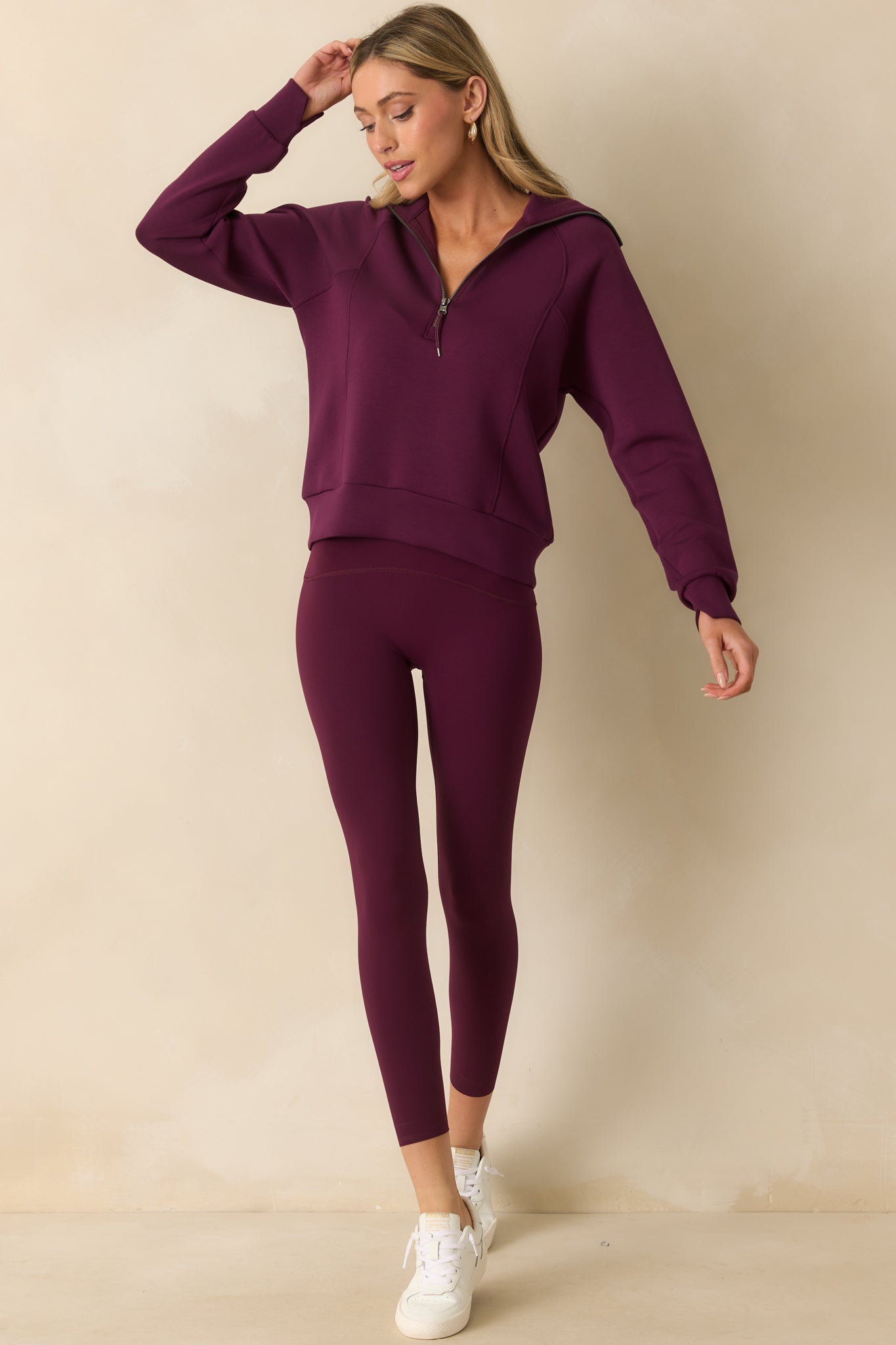 Front-facing full body image showcasing the breathable, stretchy design of the plum berry pullover.