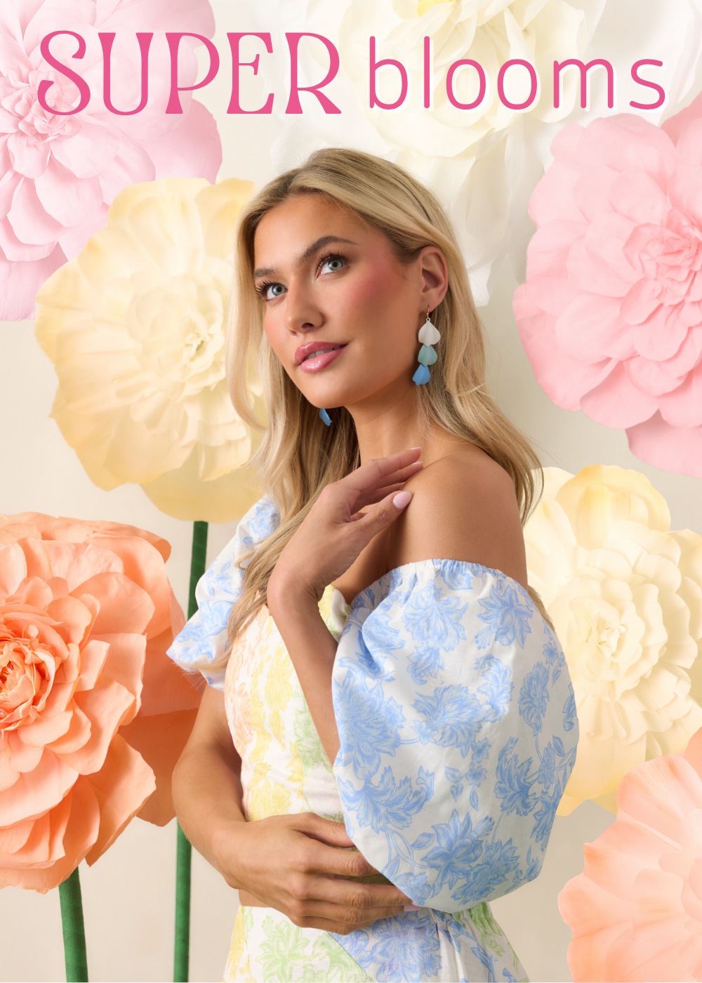 Woman in a floral dress surrounded by large flowers with 'SUPER blooms' text.