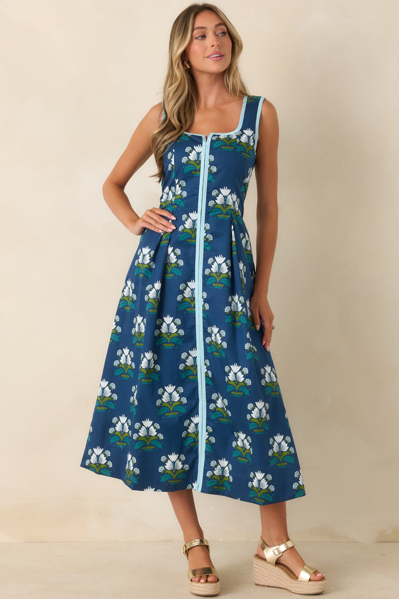 A-line dress showcasing a deep blue base, intricate floral print, and polished construction.