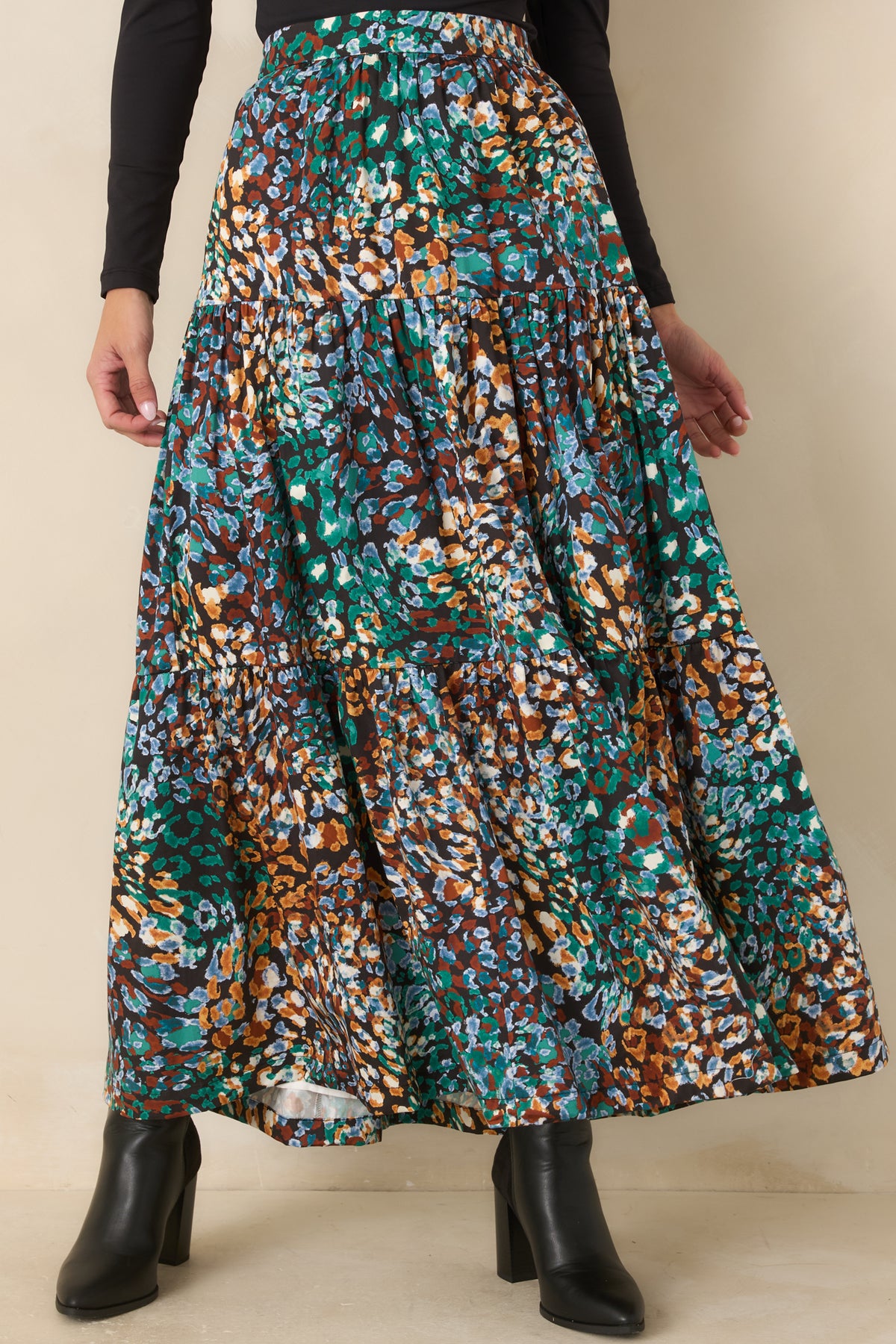 Abstract animal print highlights the fitted high-rise waistband and upper tier of the skirt.