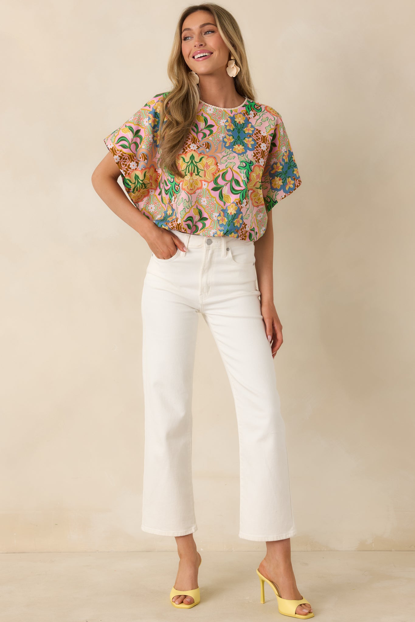 Airy top with dolman sleeves, flared hem, and eye-catching colorful print.