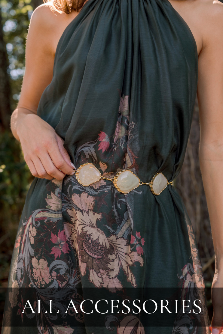 Model wearing a green floral dress with stone belt. Text reads: "All Accessories."