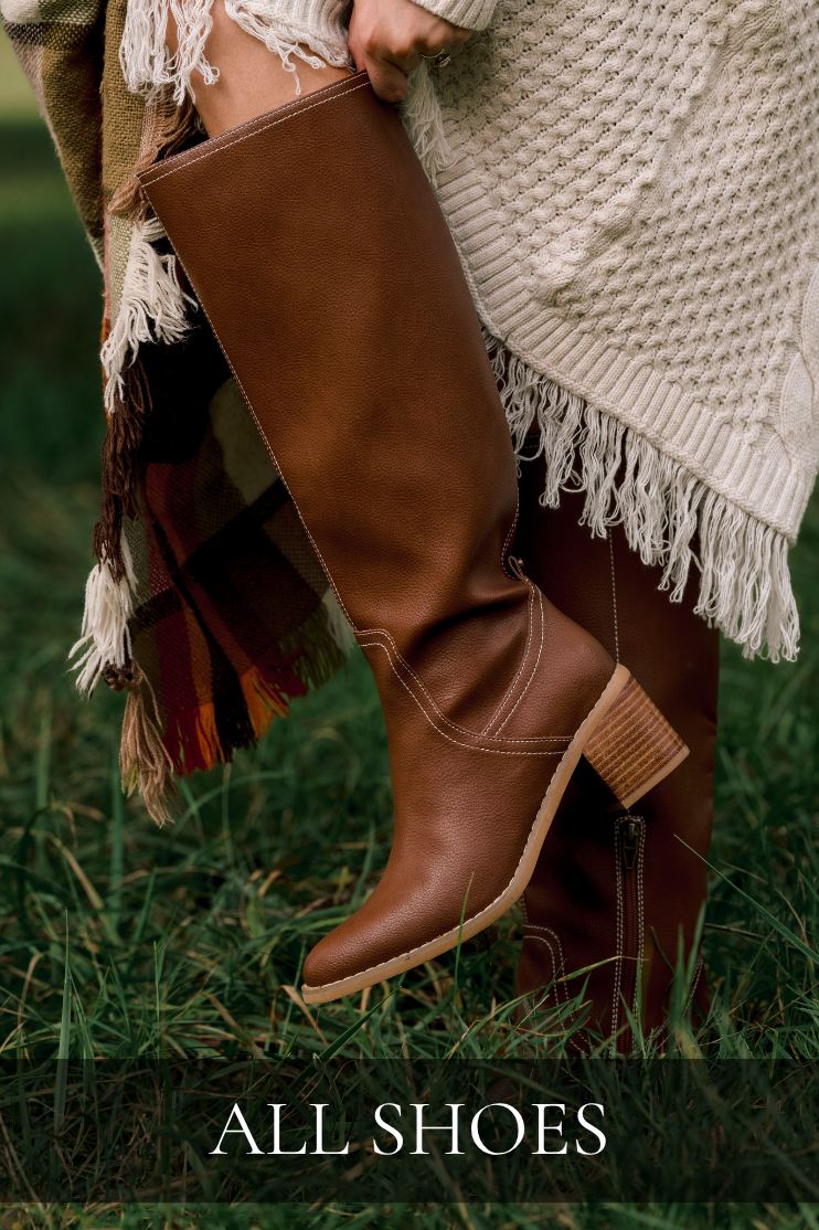 Model wearing brown faux leather boots. Text reads: "All Shoes."