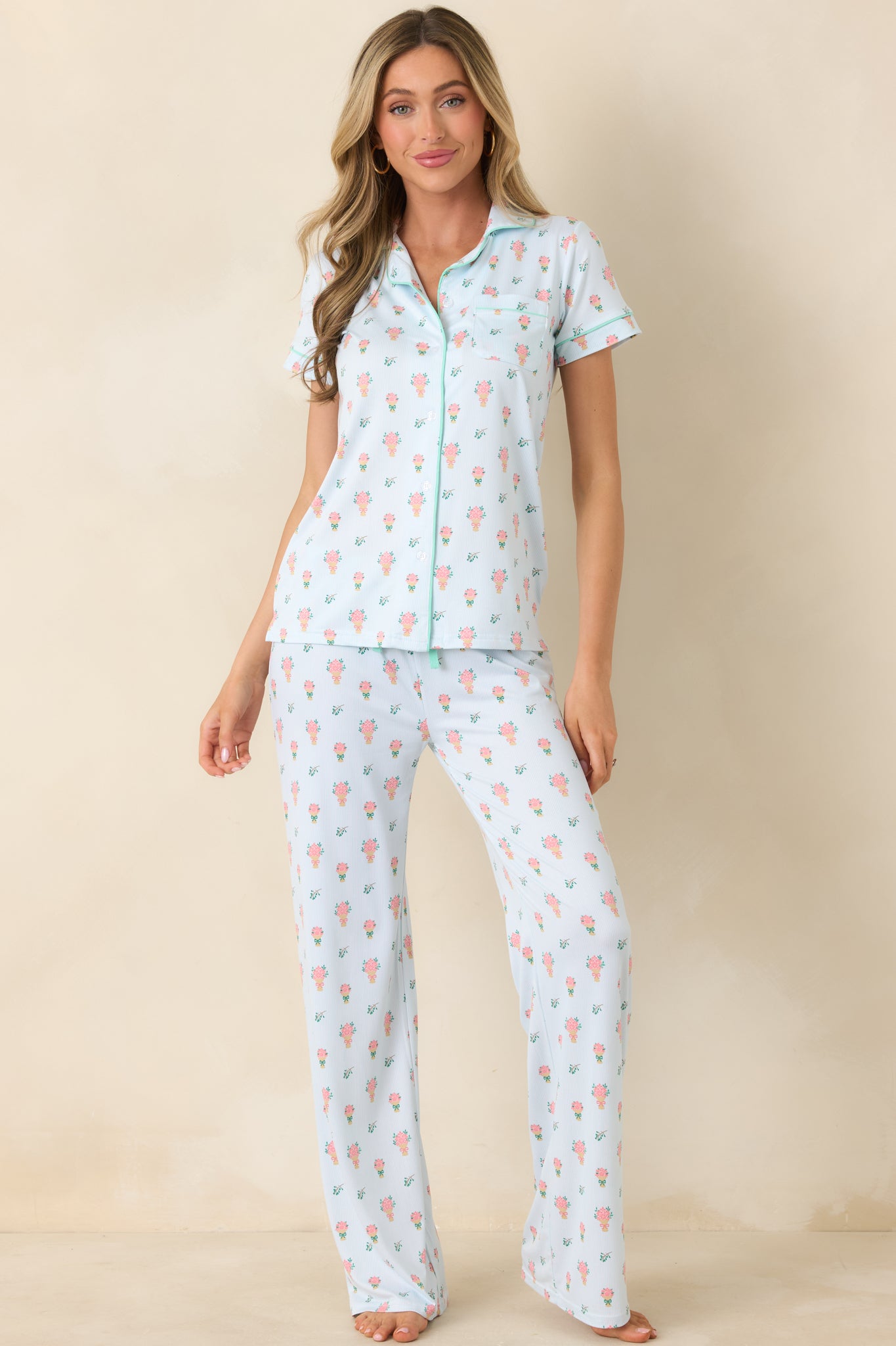 Allover petite bouquet print top in a gentle green hue, finished with refined piping and a clean, tailored shape.