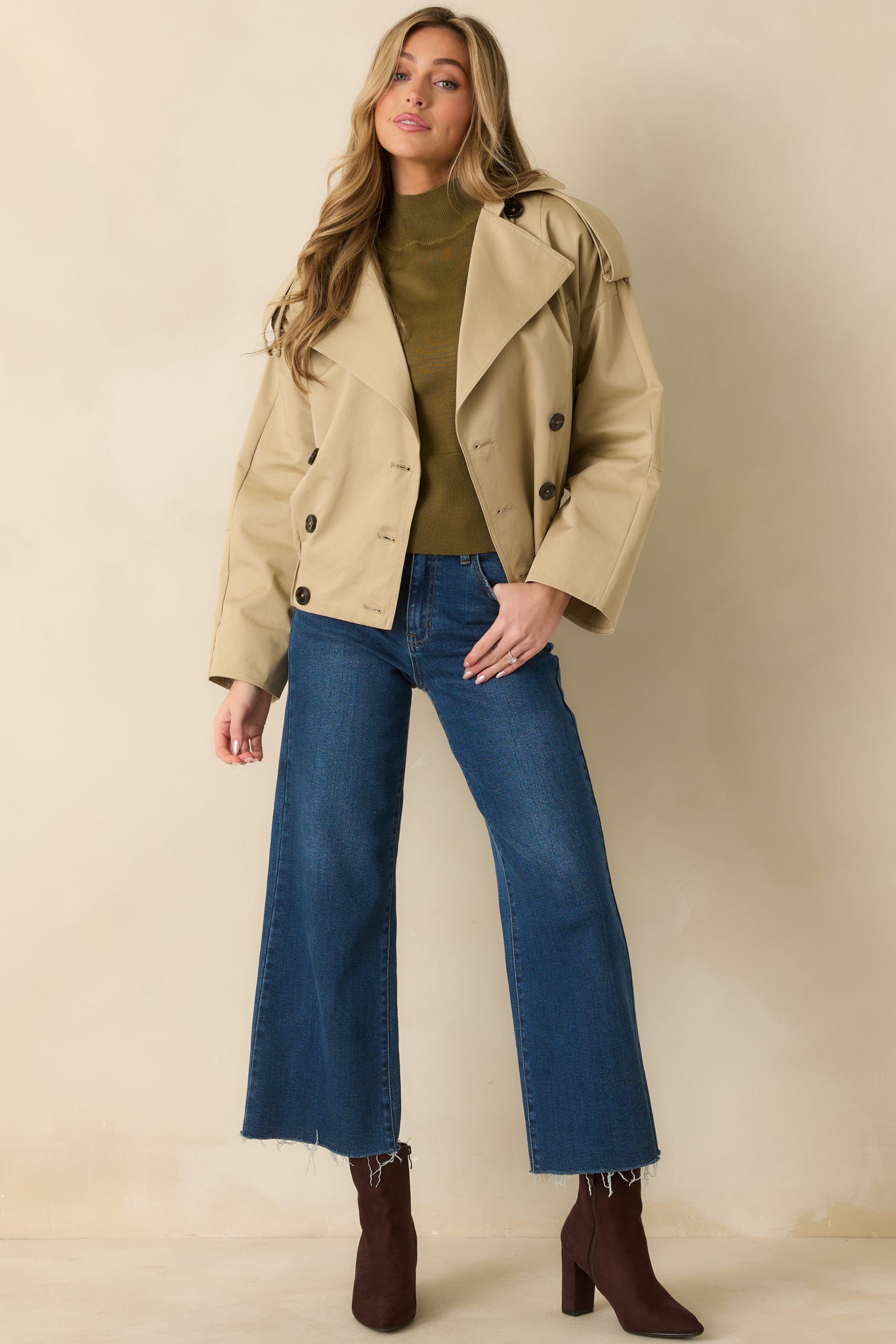 Slightly angled front view showing detachable belt tabs, four-button front, and relaxed tailored silhouette.