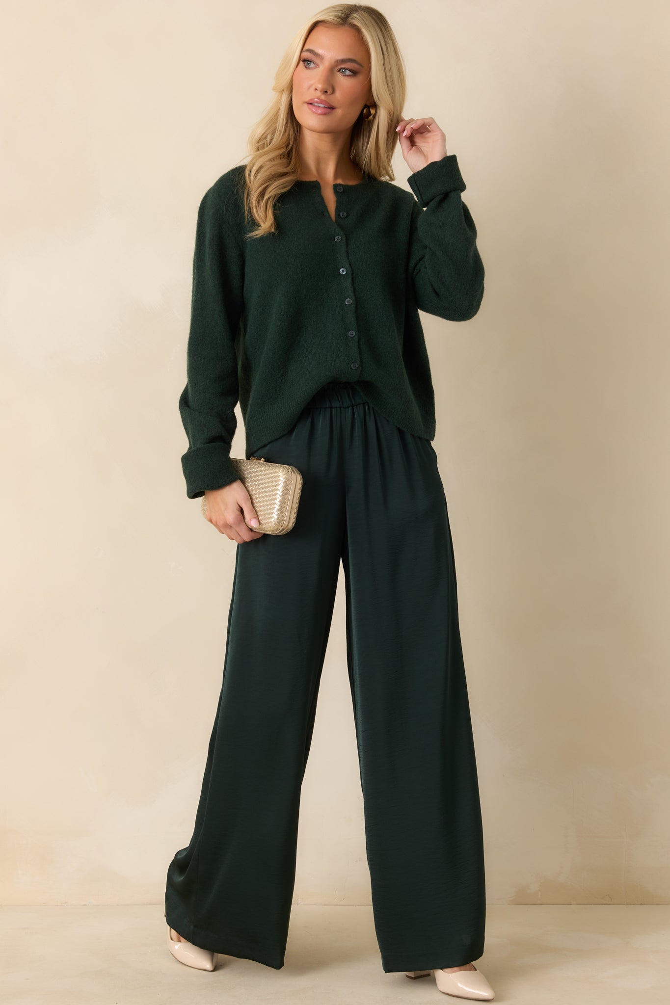 Angled front shot highlighting fluid fabric, elastic waistband, and side pocket detail.