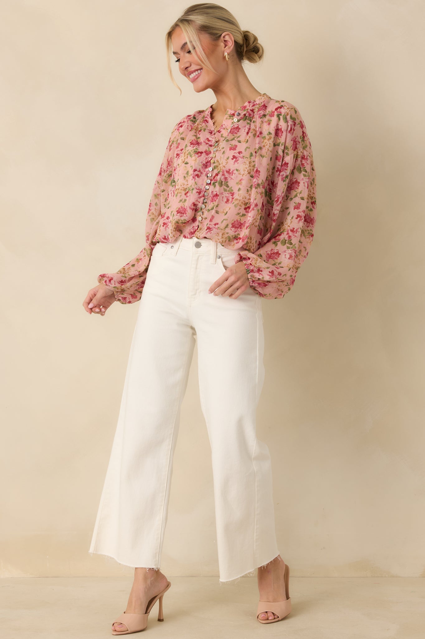 Angled front view emphasizing the soft sheer fabric and relaxed fit of the blouse.