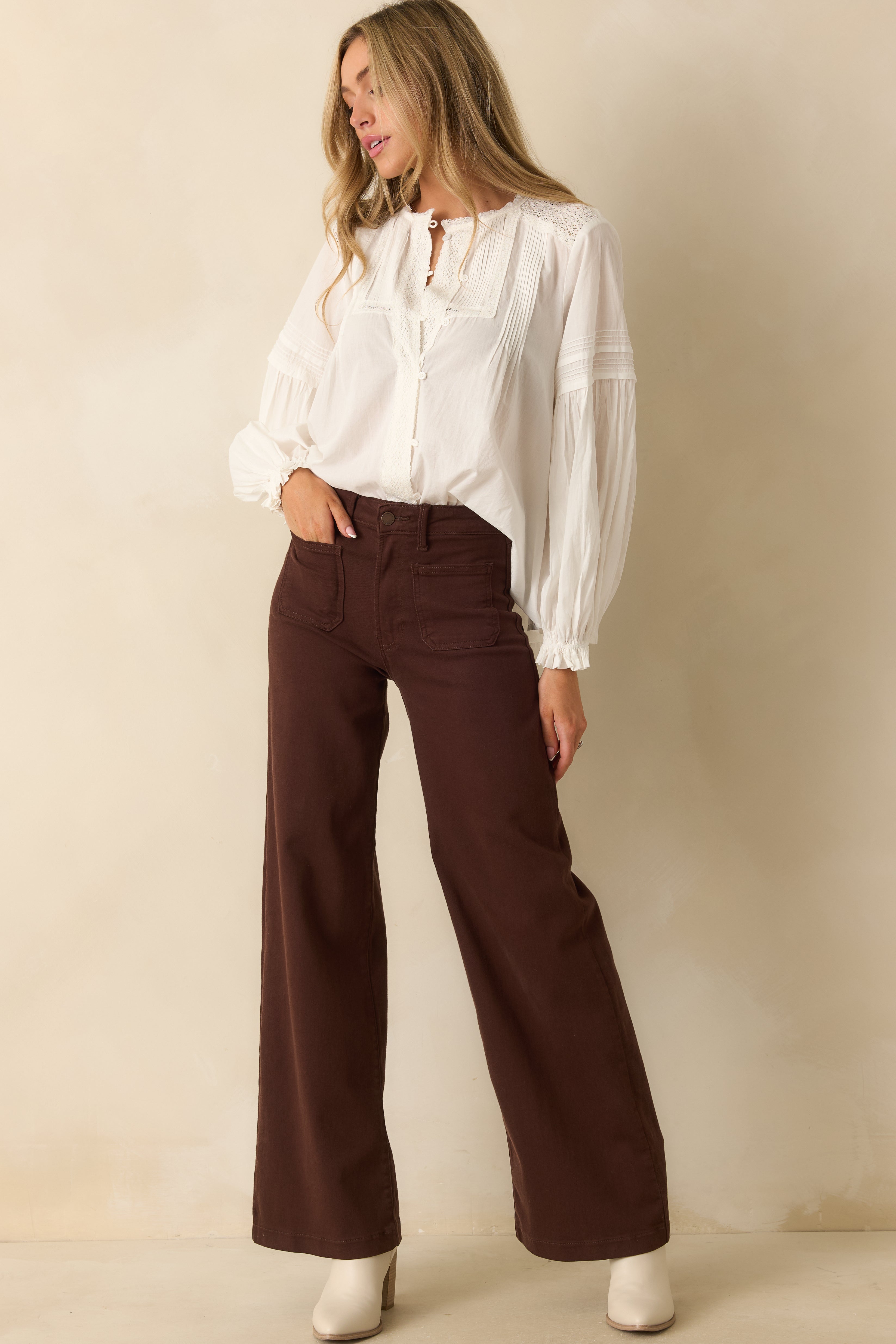 Slight angled front view emphasizing the functional front patch pockets and overall fit.