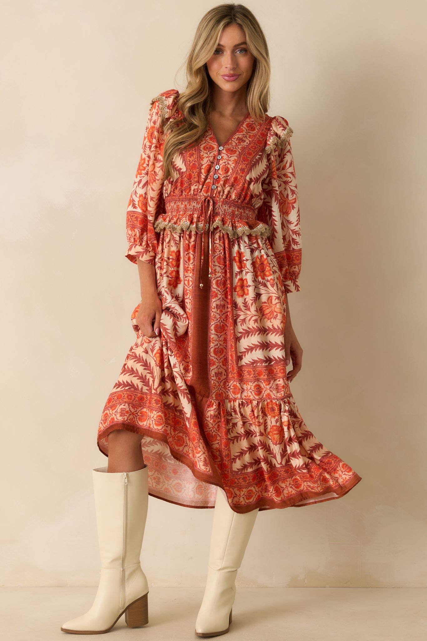 Full body angled view emphasizing the tiered skirt and flowy silhouette of the printed maxi dress.