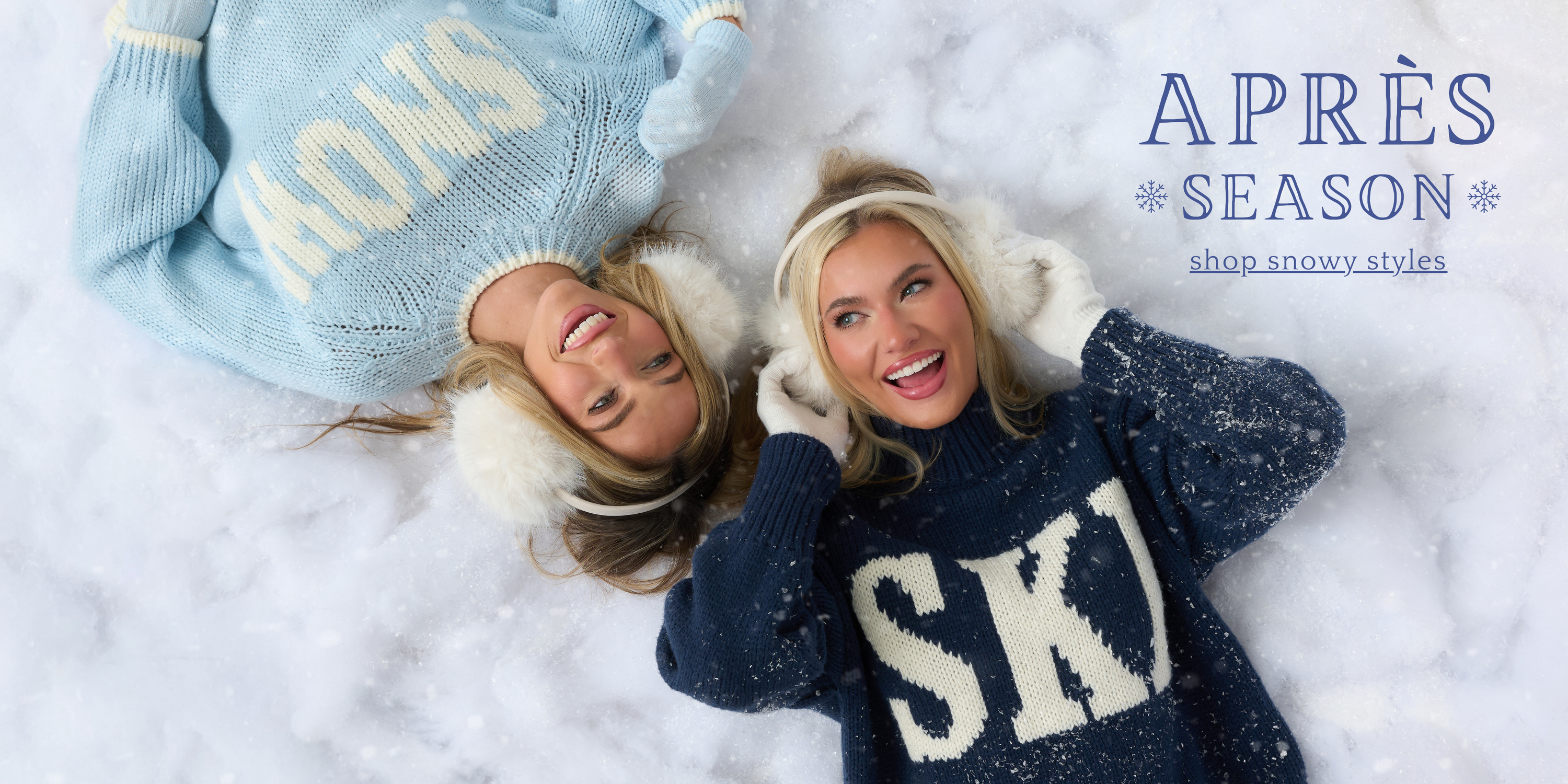 Models wearing chunky knit ‘SNOW’ and ‘SKI’ sweaters, earmuffs, and winter accessories while lying in fresh snow—banner promoting après-ski and snowy season styles.