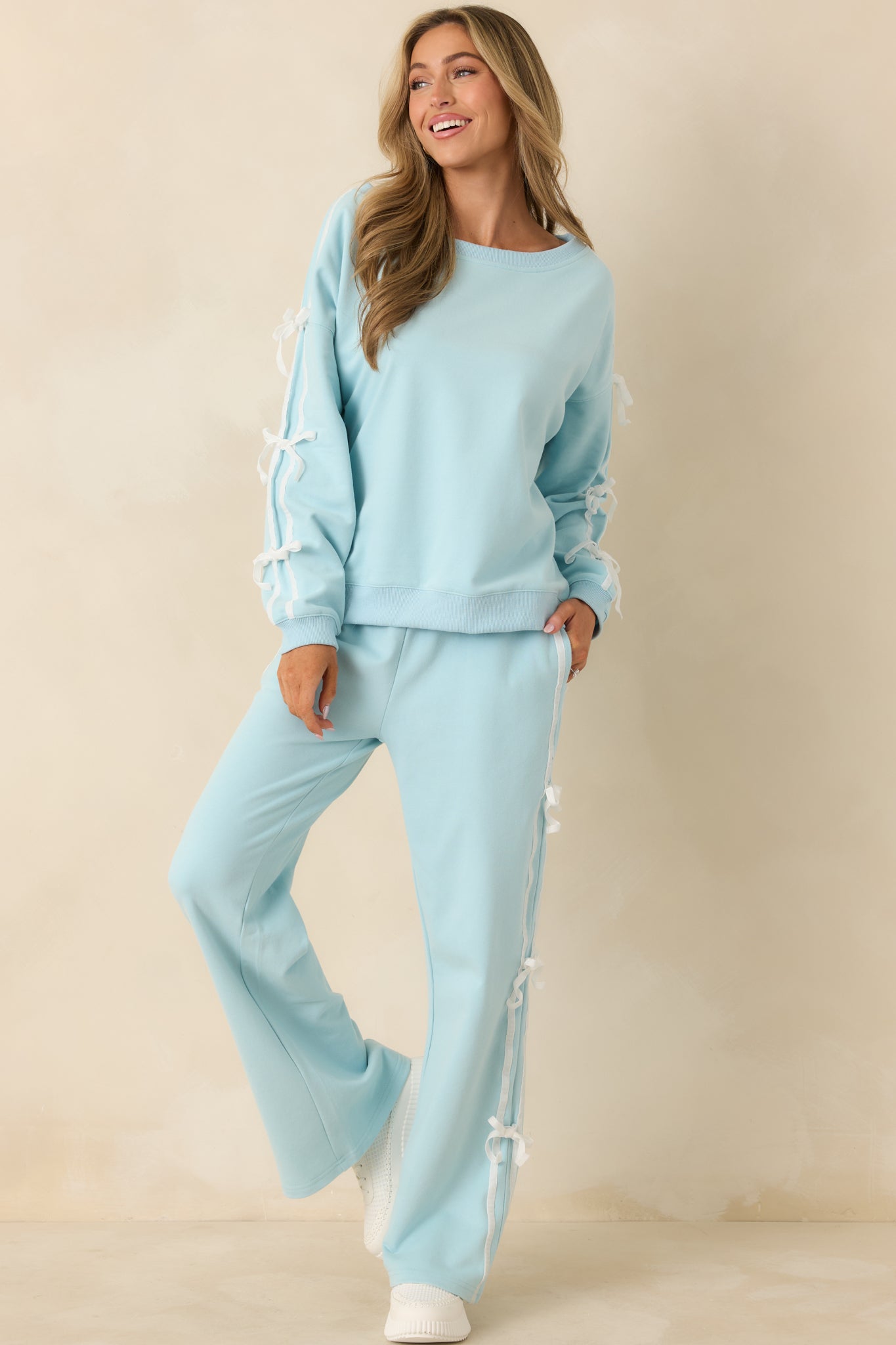 Aqua blue sweatshirt with relaxed fit and wide scoop neckline.
