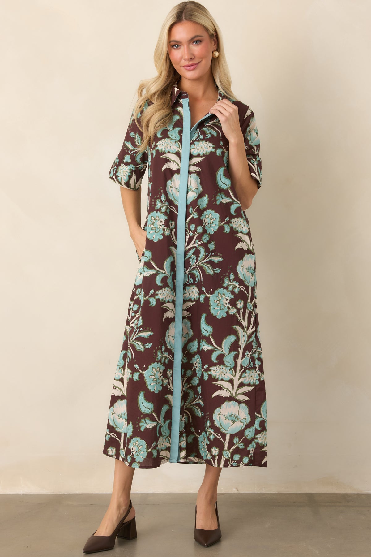Aqua and ivory botanical print covers the relaxed cotton dress, finished with a pointed collar and contrasting aqua front placket.