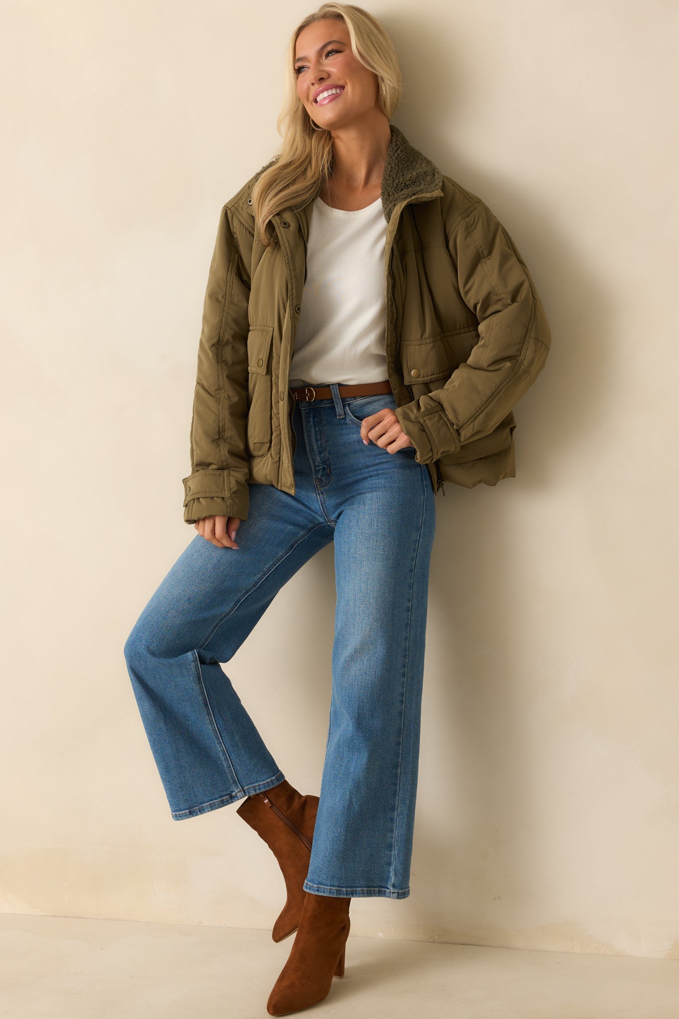 Army green puffer jacket with a sherpa-lined spread collar, front zip and snap button placket, and relaxed boxy fit.