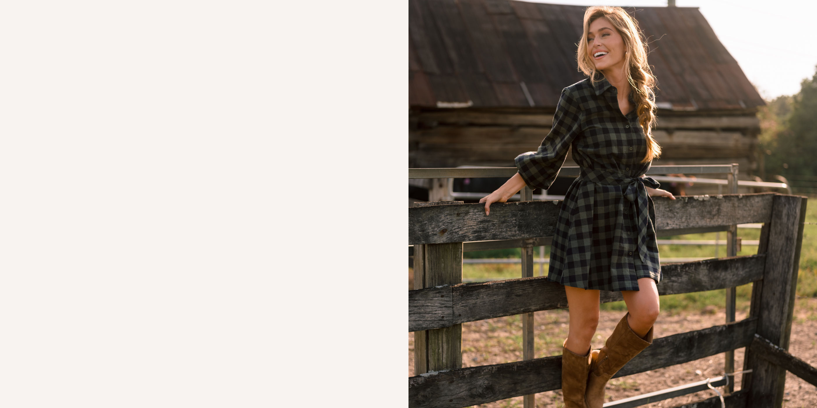 Women in a green plaid mini dress with long sleeves and a waist tie. She is standing against a fence on a farm. 