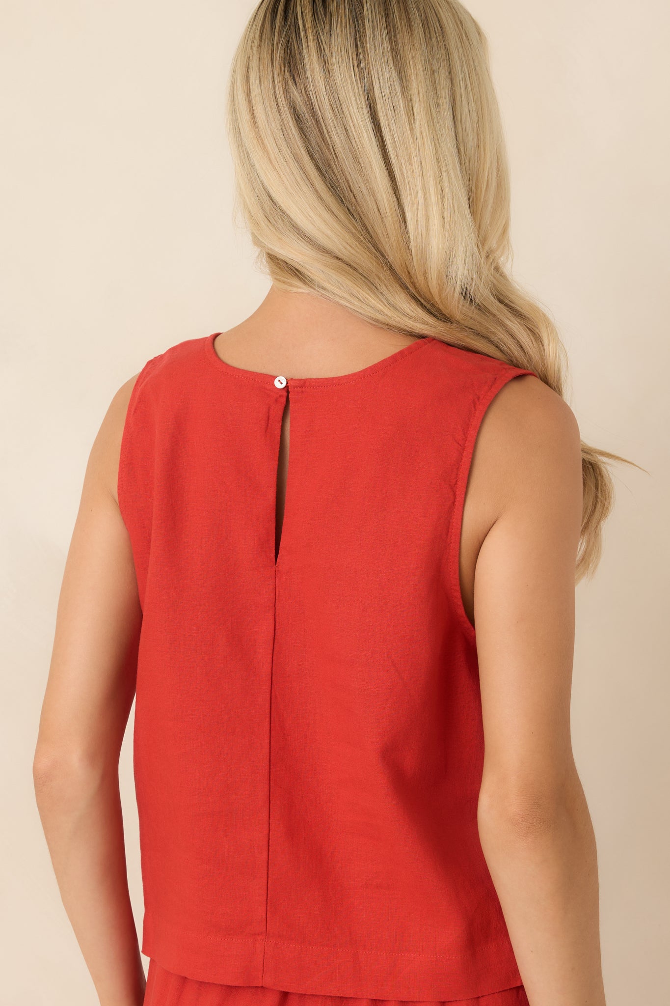 Back view of the chili pepper red tank featuring a subtle keyhole closure and boxy silhouette.