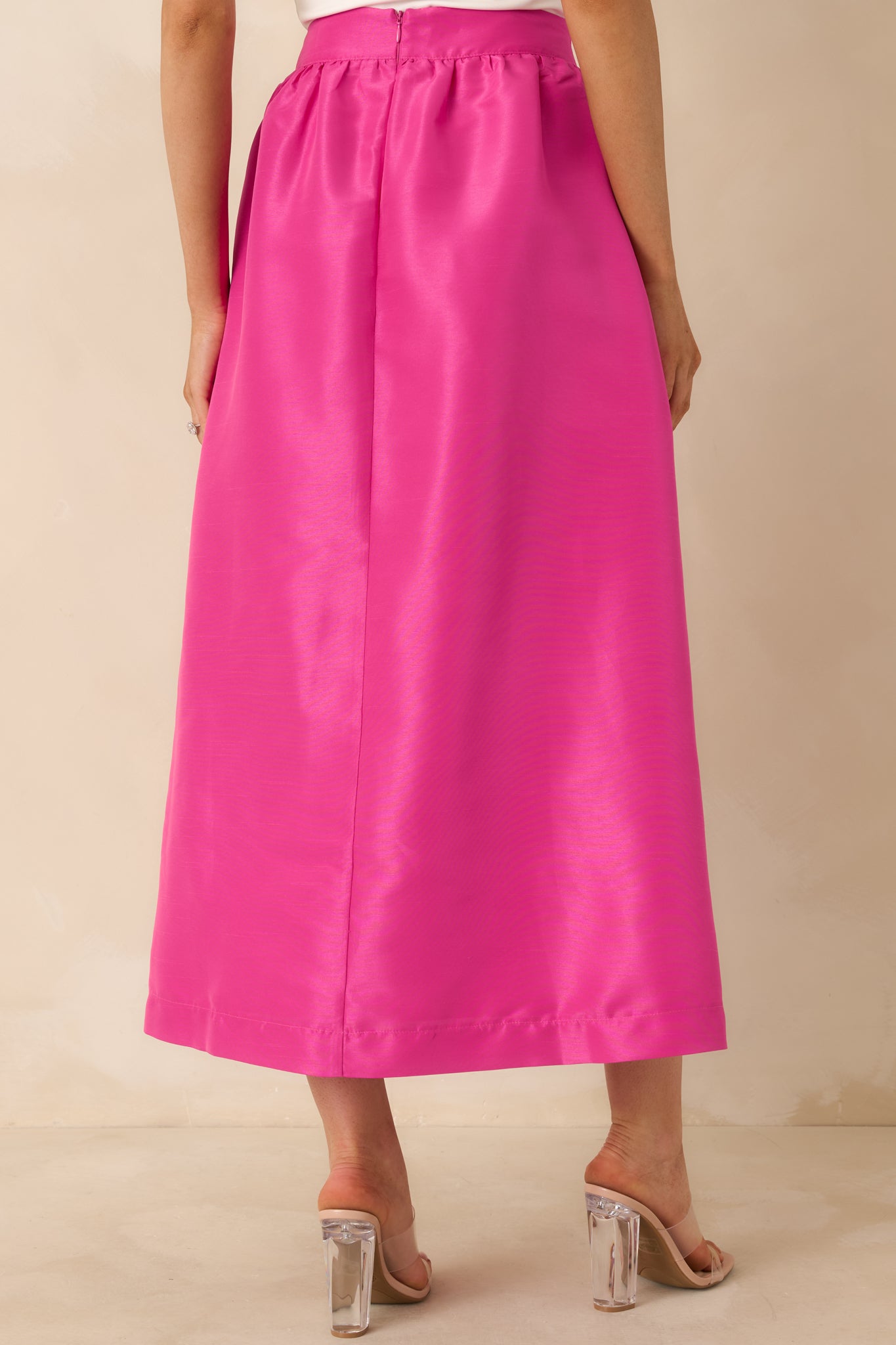 Back view of the fuchsia pink maxi skirt displaying the full-length silhouette and soft drape.