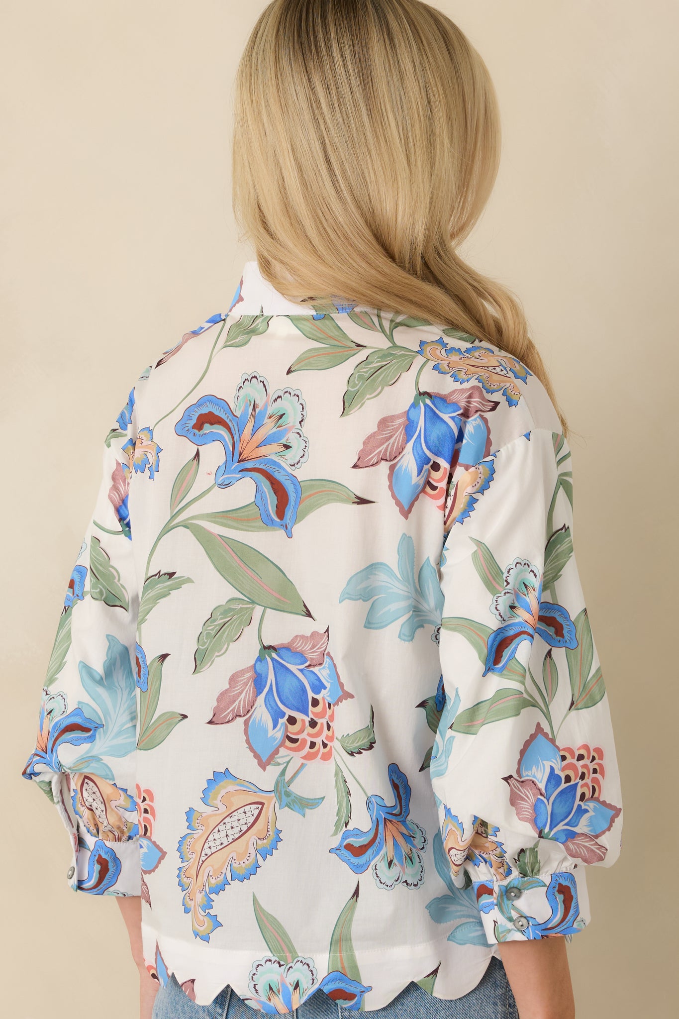 Back view of the blue multicolor top highlighting the smooth cotton fabric and relaxed silhouette.
