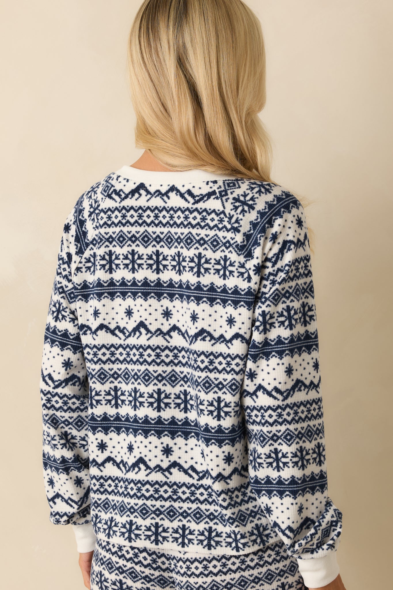 Back view of the ivory and navy Fair Isle top showing the full pattern and soft velour fabric texture.
