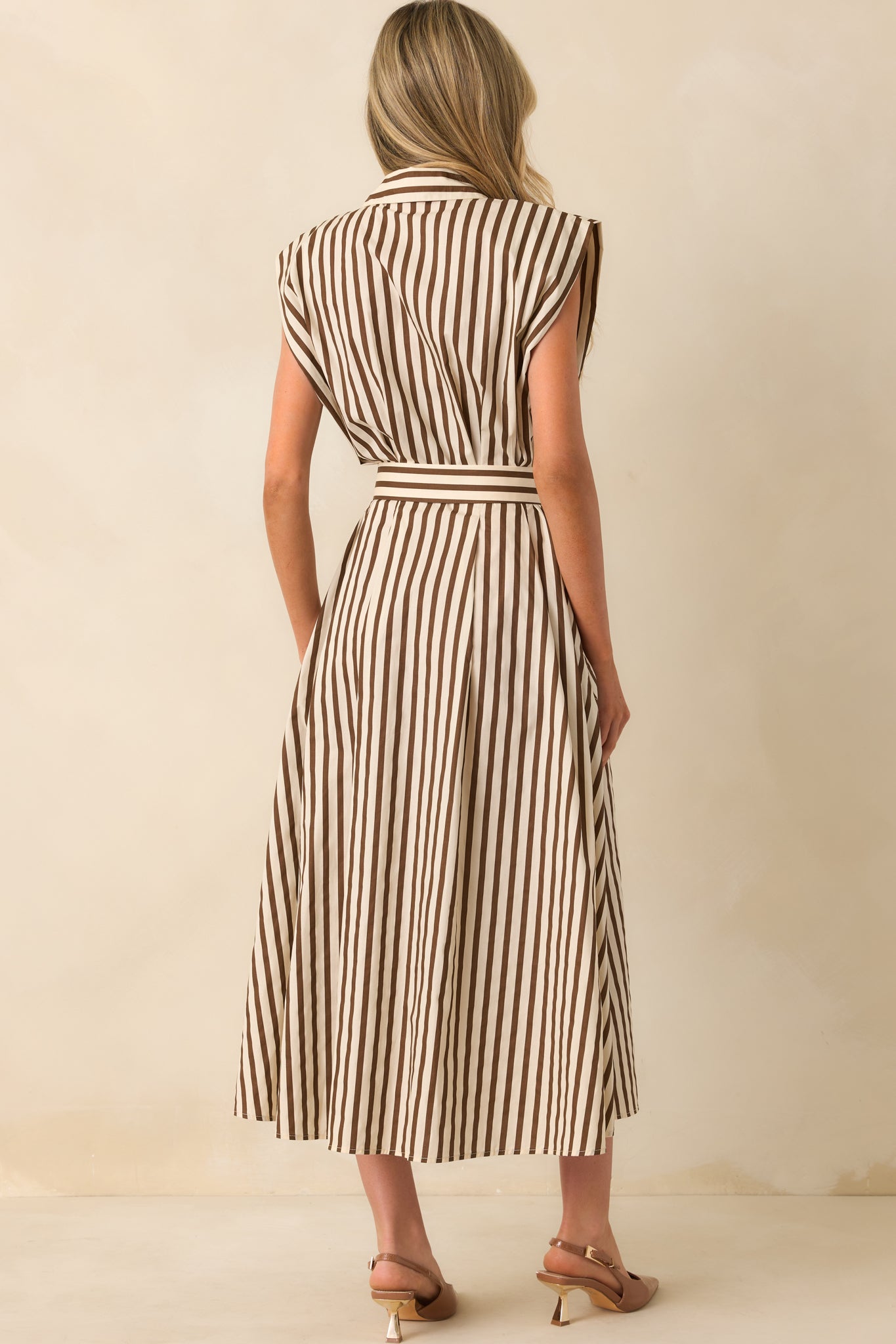 A back view of the mocha dress showing the back waistline, belt ties, and smooth drape of the skirt.
