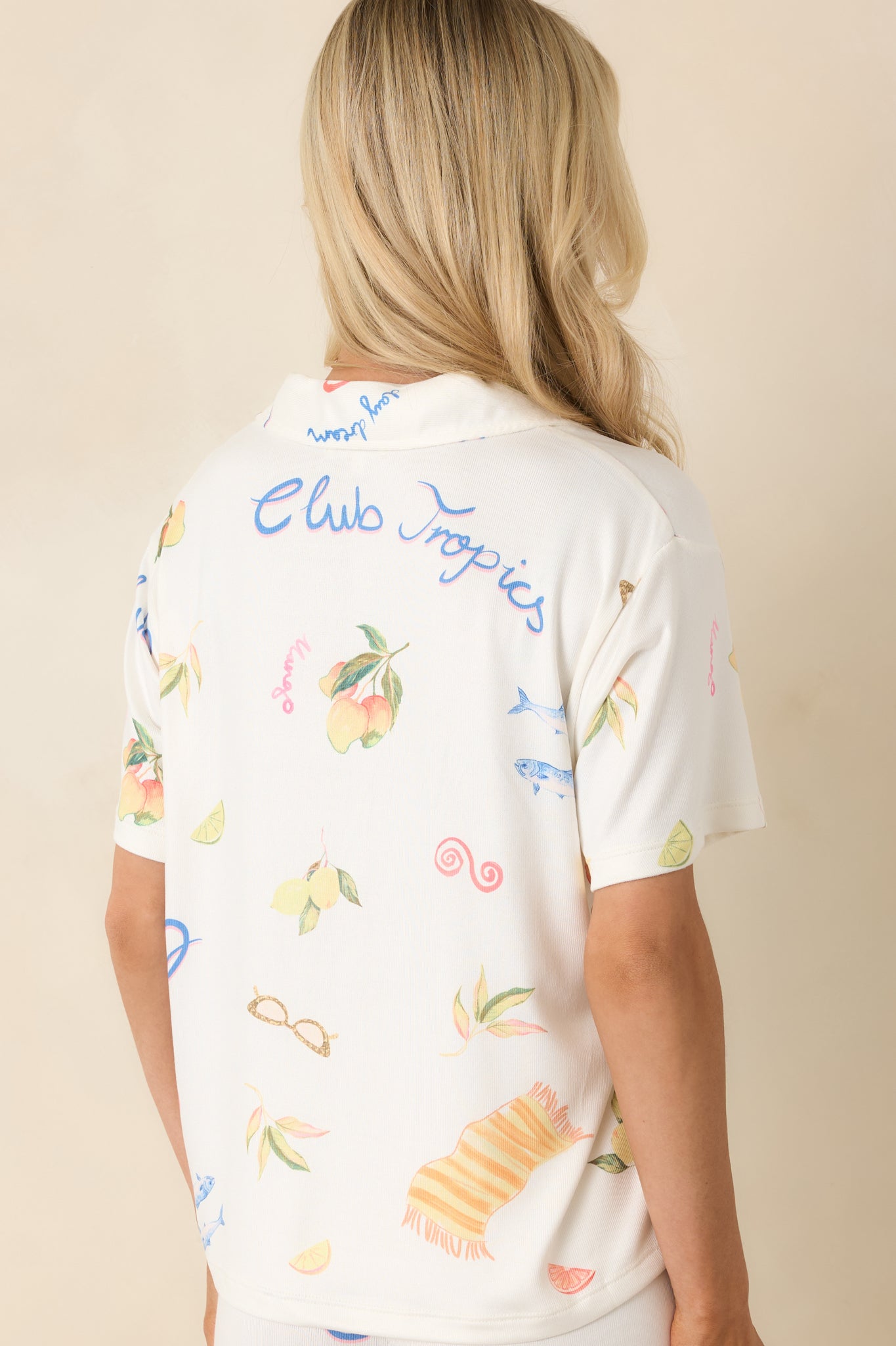 Back view of vanilla ice pajama top with relaxed silhouette and allover vintage tropical print