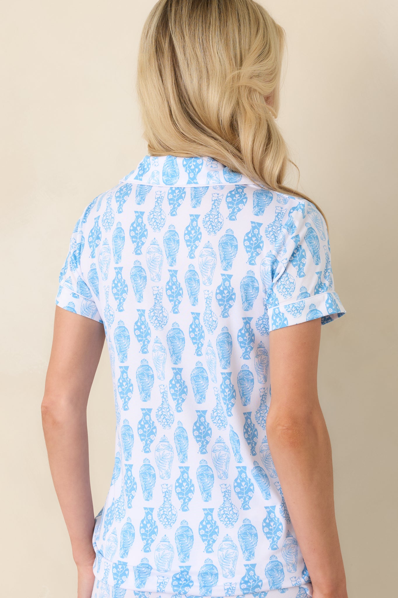 Back view of a blue and white short sleeve pajama top with relaxed silhouette and porcelain-inspired print.