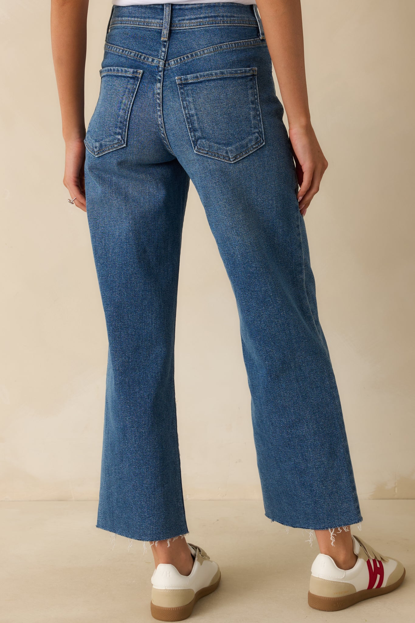 Back view of the jeans showing back pockets, belt loops, and high-rise waist.