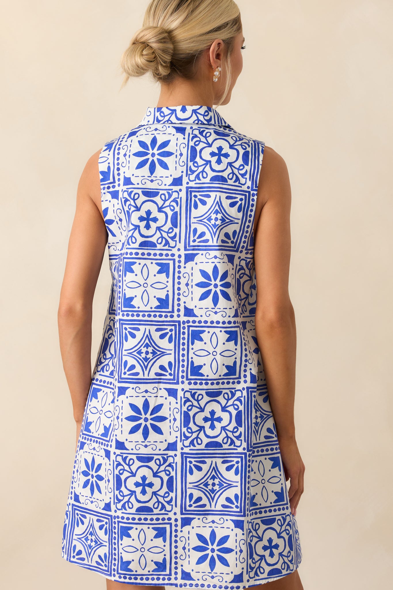 A view from behind highlighting the sleeveless design and full continuation of the tile print across the back.
