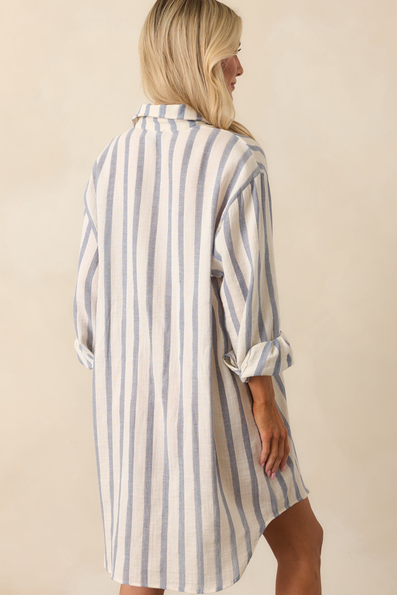 A view from behind showing the continuous stripe pattern and relaxed drape of the mini shirt dress.