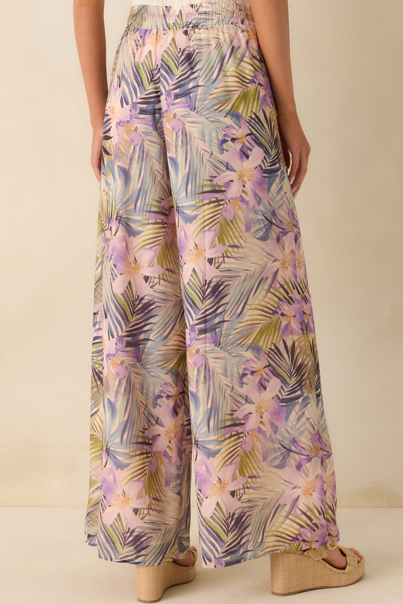 A view from behind showing the wide leg silhouette, full chiffon overlay, and smooth fit at the elastic waistband.