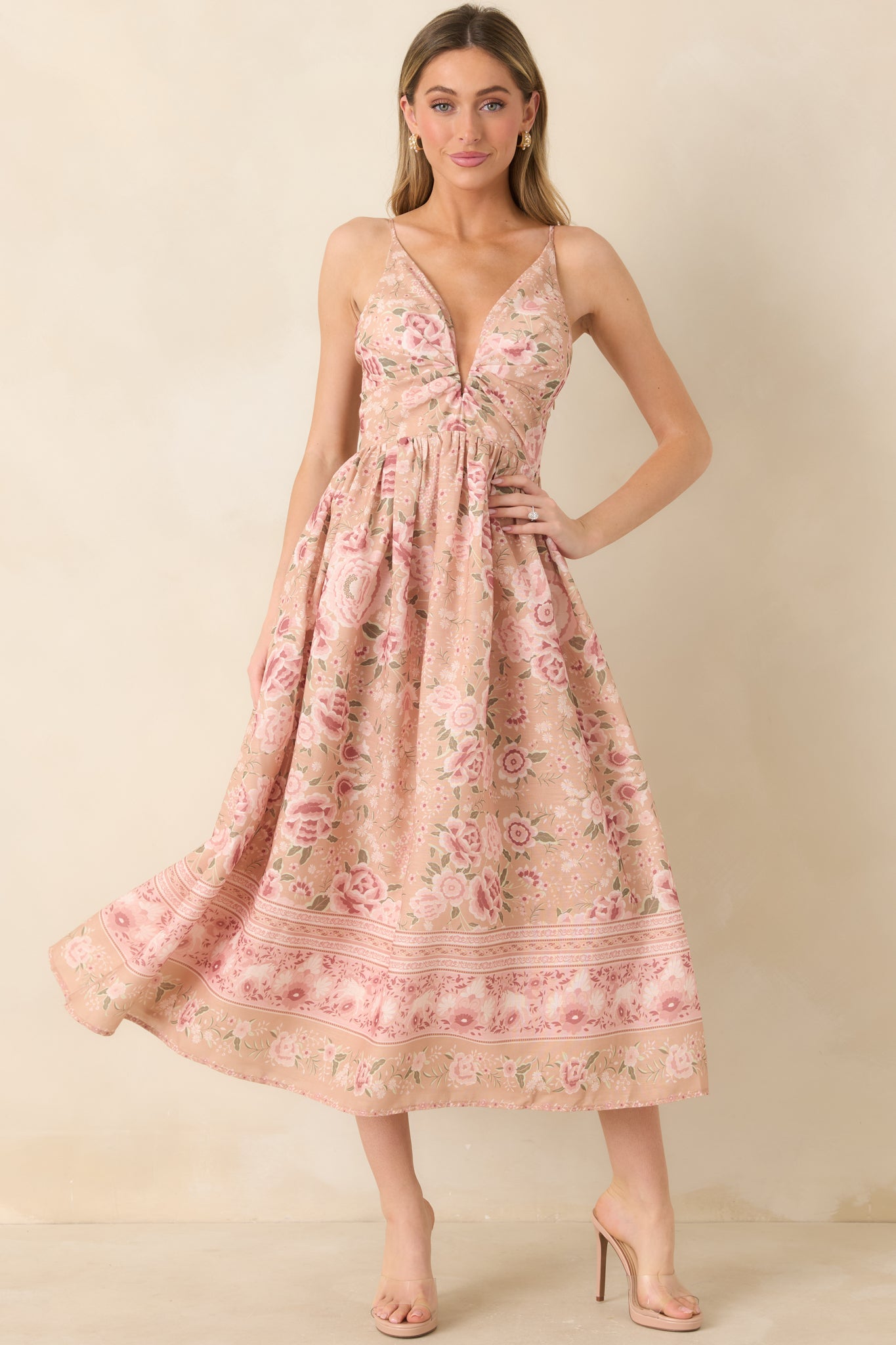 Beige and pink floral midi dress with a deep V-neckline and an easy, flowy silhouette.