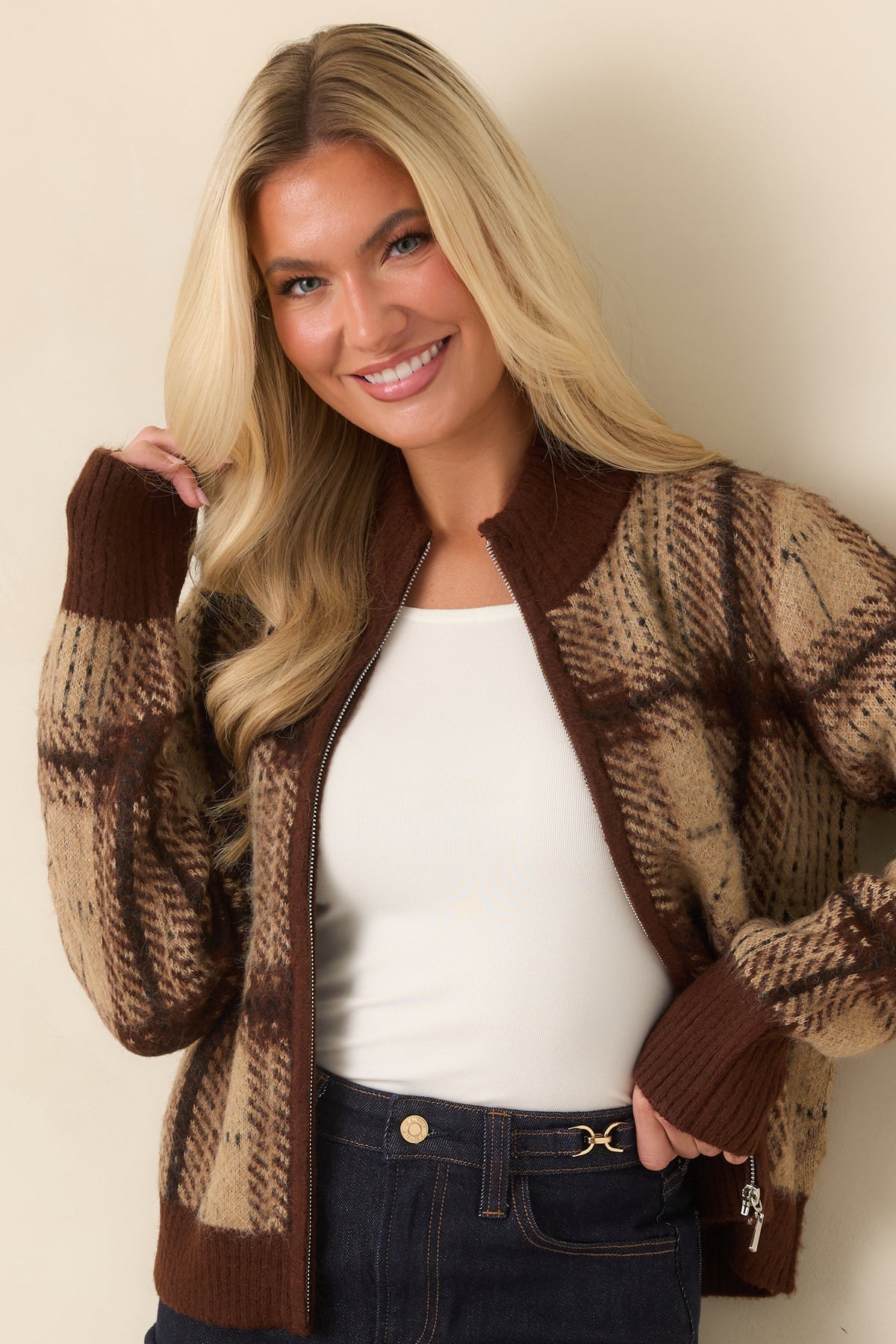 Softly textured plaid cardigan showcasing beige and brown checks with fine dark lines.