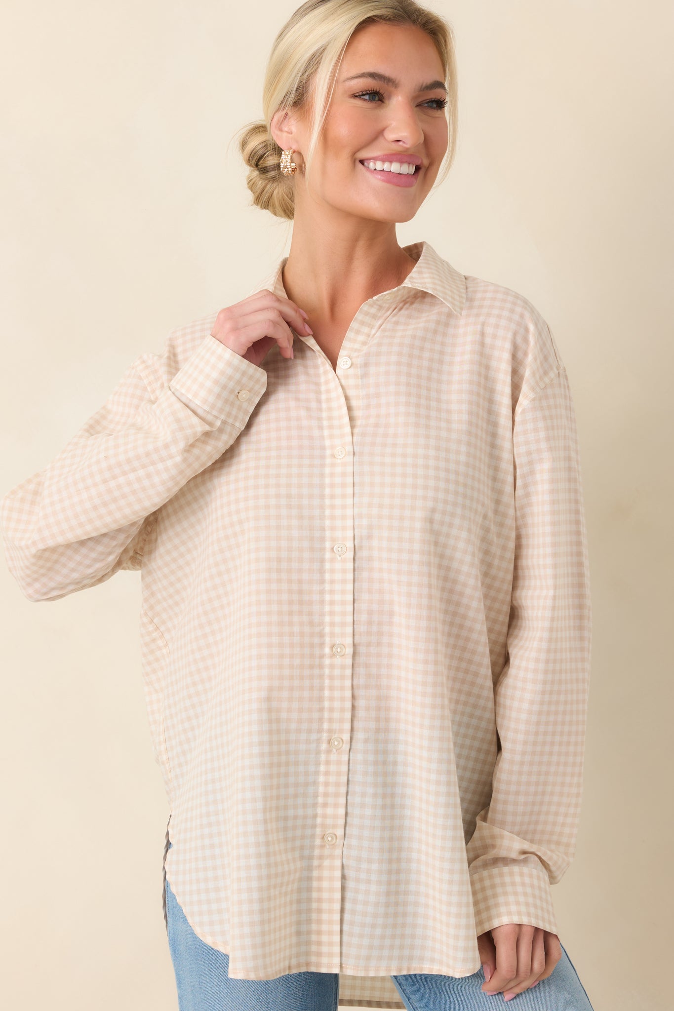 Beige gingham blouse featuring rolled sleeve detail and a relaxed, easy fit.