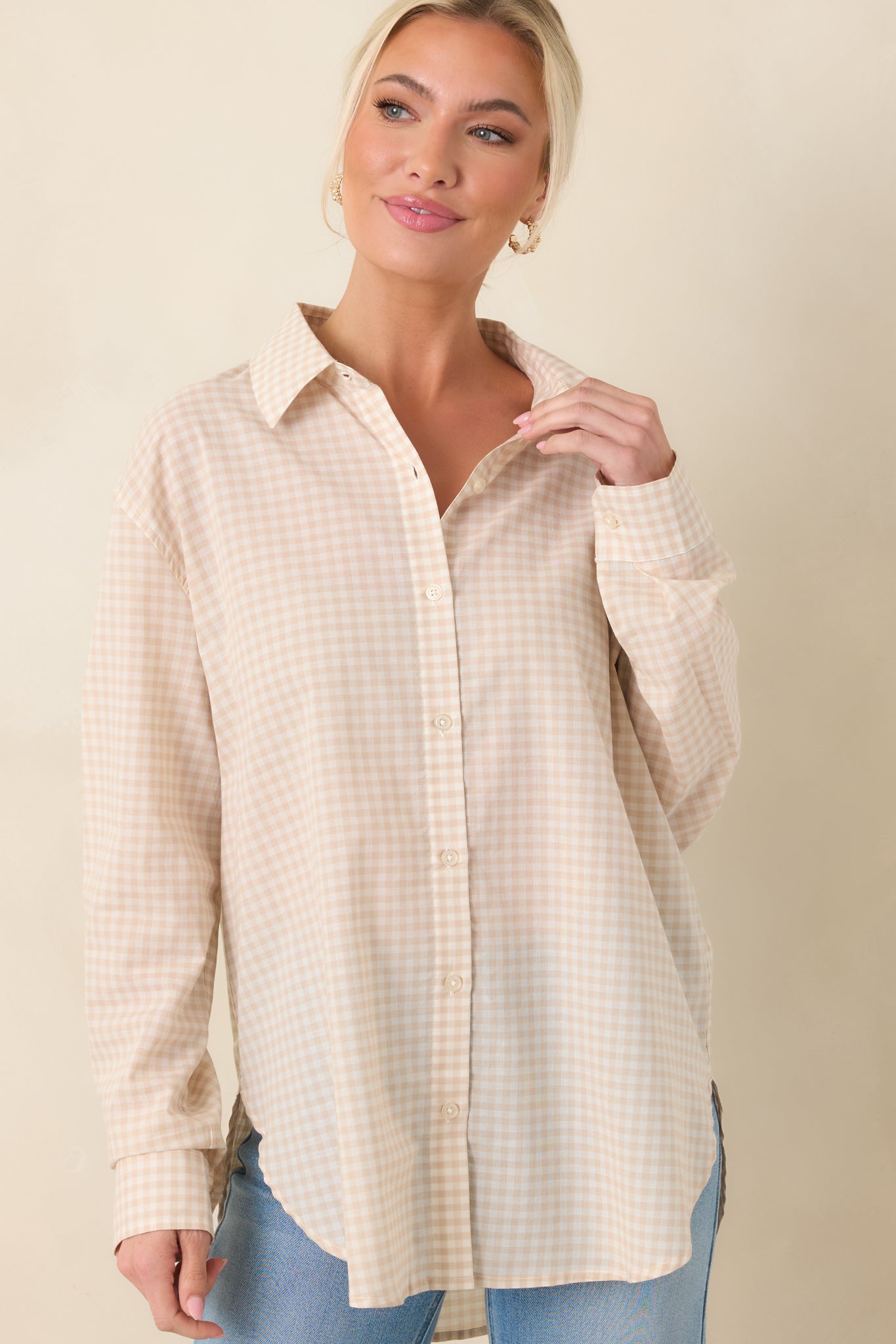 Beige gingham print top with a classic collar and front button-down design.