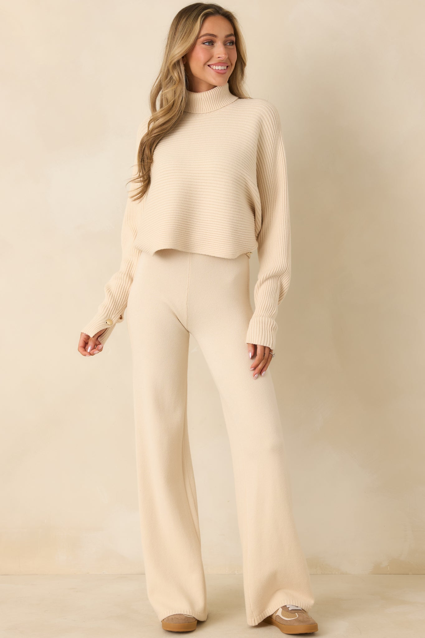 Relaxed fit beige pull-on pants with comfortable waistband and clean seam construction.
