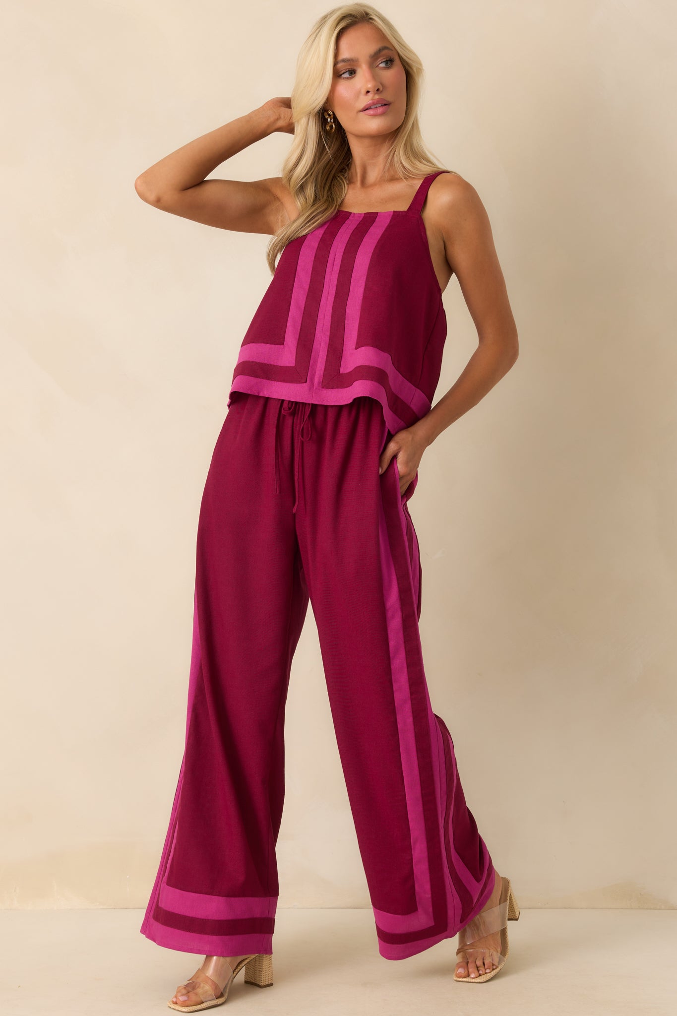 Full body front-facing image highlighting the pink and berry contrast trim along the neckline and center seam.