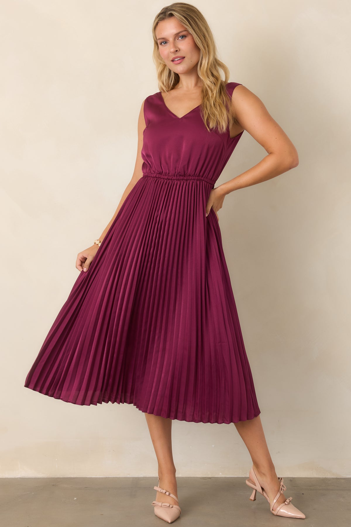 Berry set highlighting the open knit sweater, elastic waist, and softly pleated satin skirt.