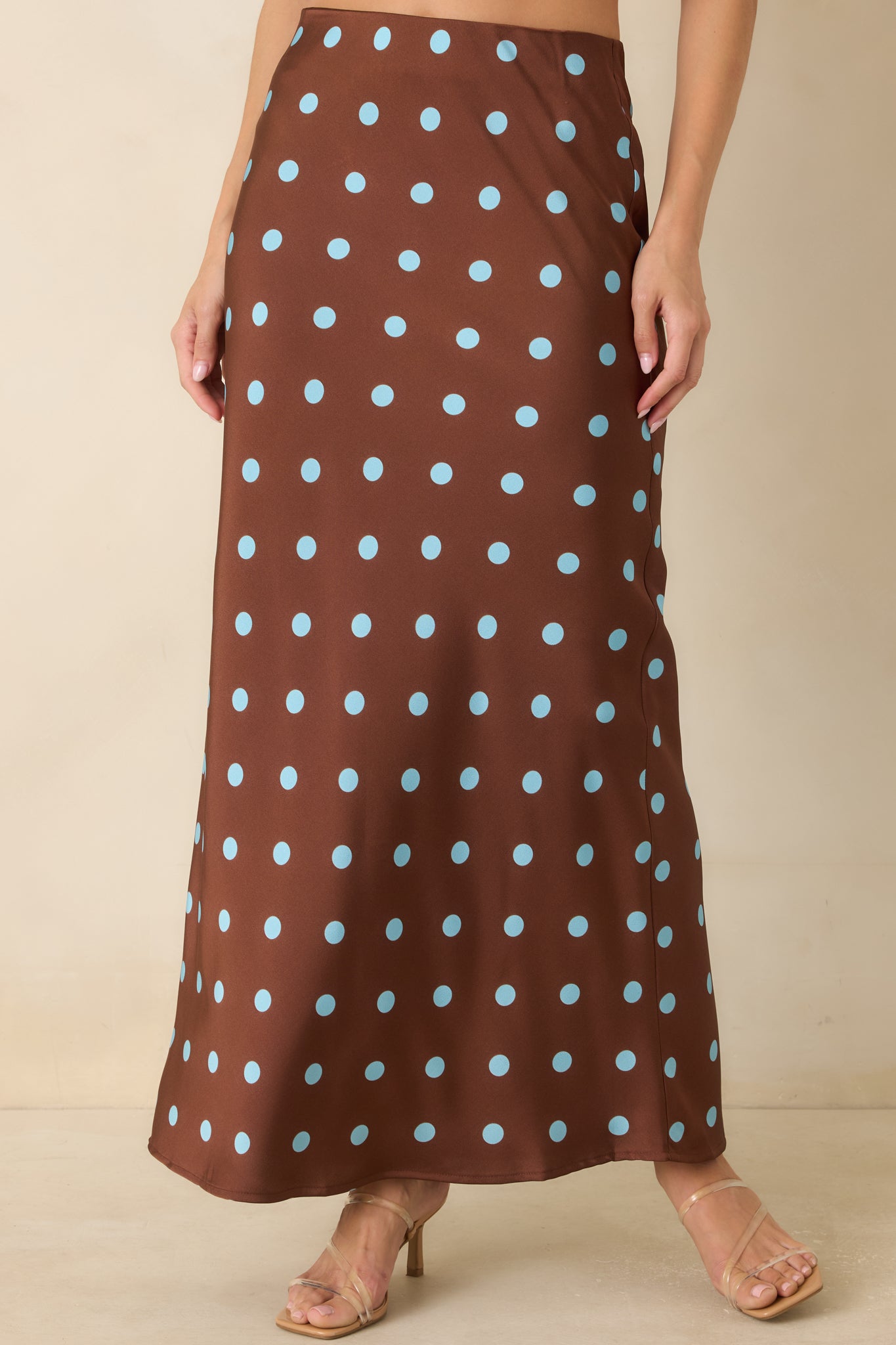 Cropped view of the satin skirt showcasing the bias-cut construction and fluid drape of the fabric.