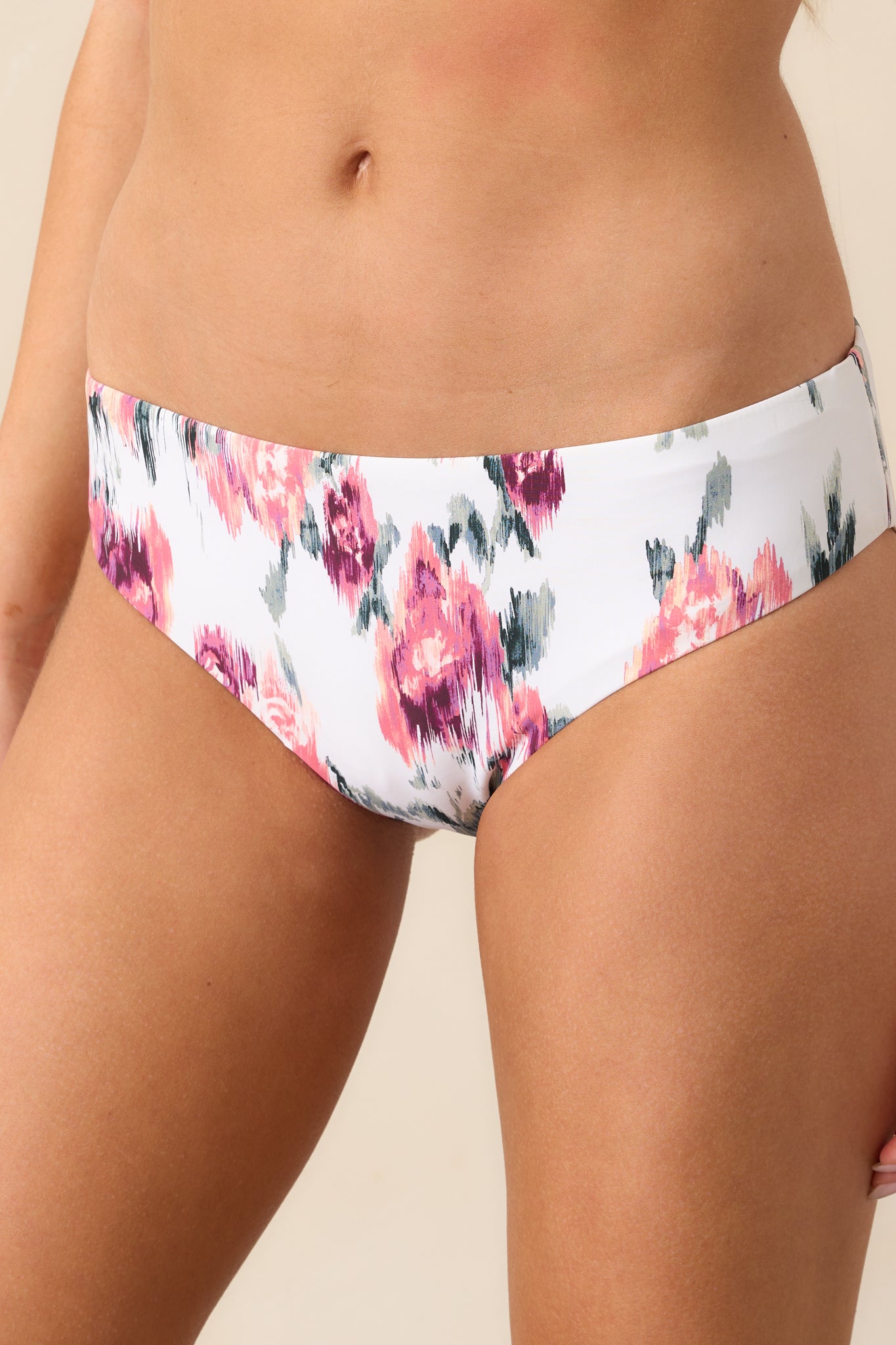 A zoomed-in view of the floral design on the bikini bottoms, showcasing the intricate rose pattern and subtle color details.